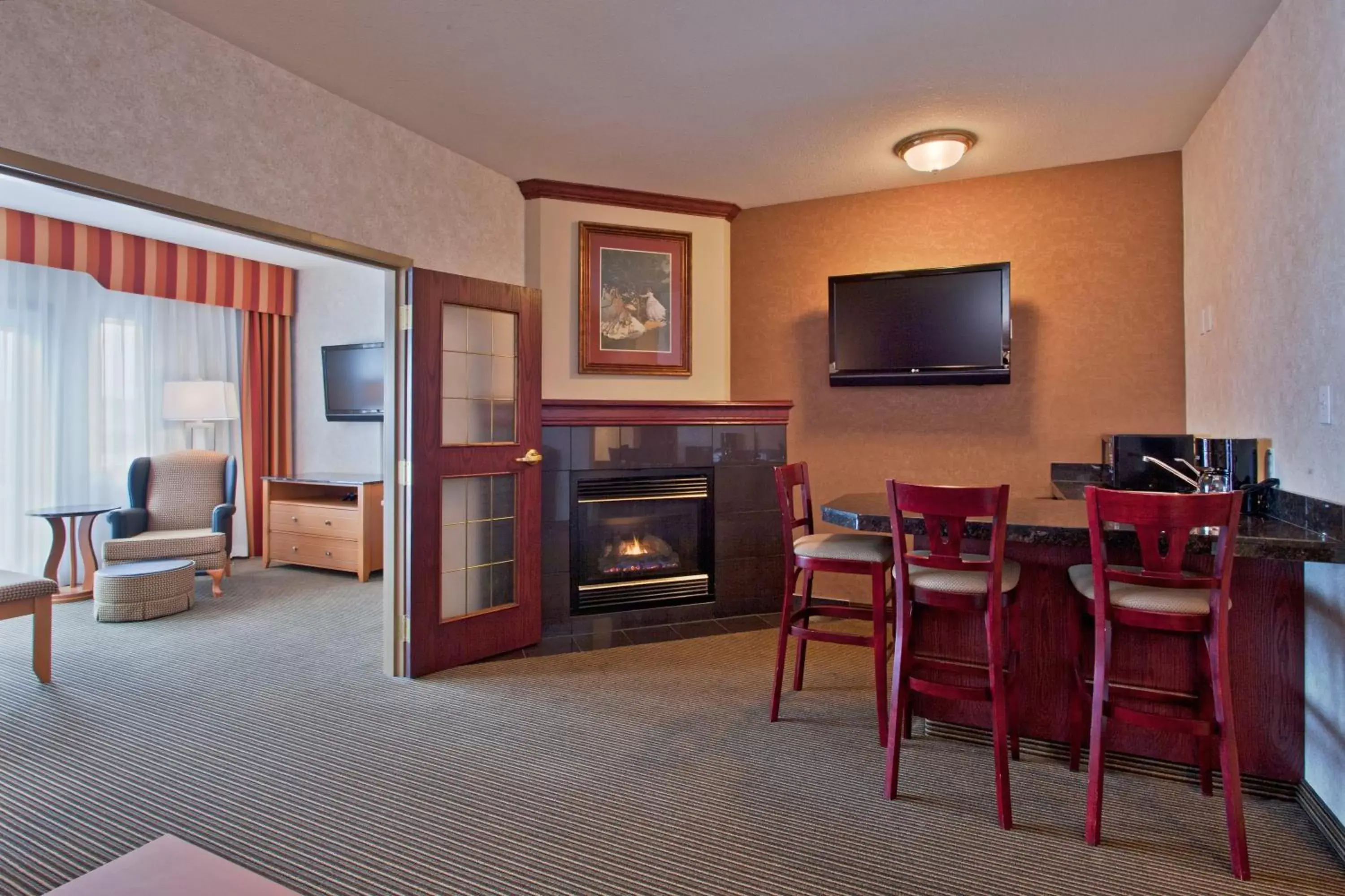Photo of the whole room, TV/Entertainment Center in Holiday Inn Express Calgary South, an IHG Hotel