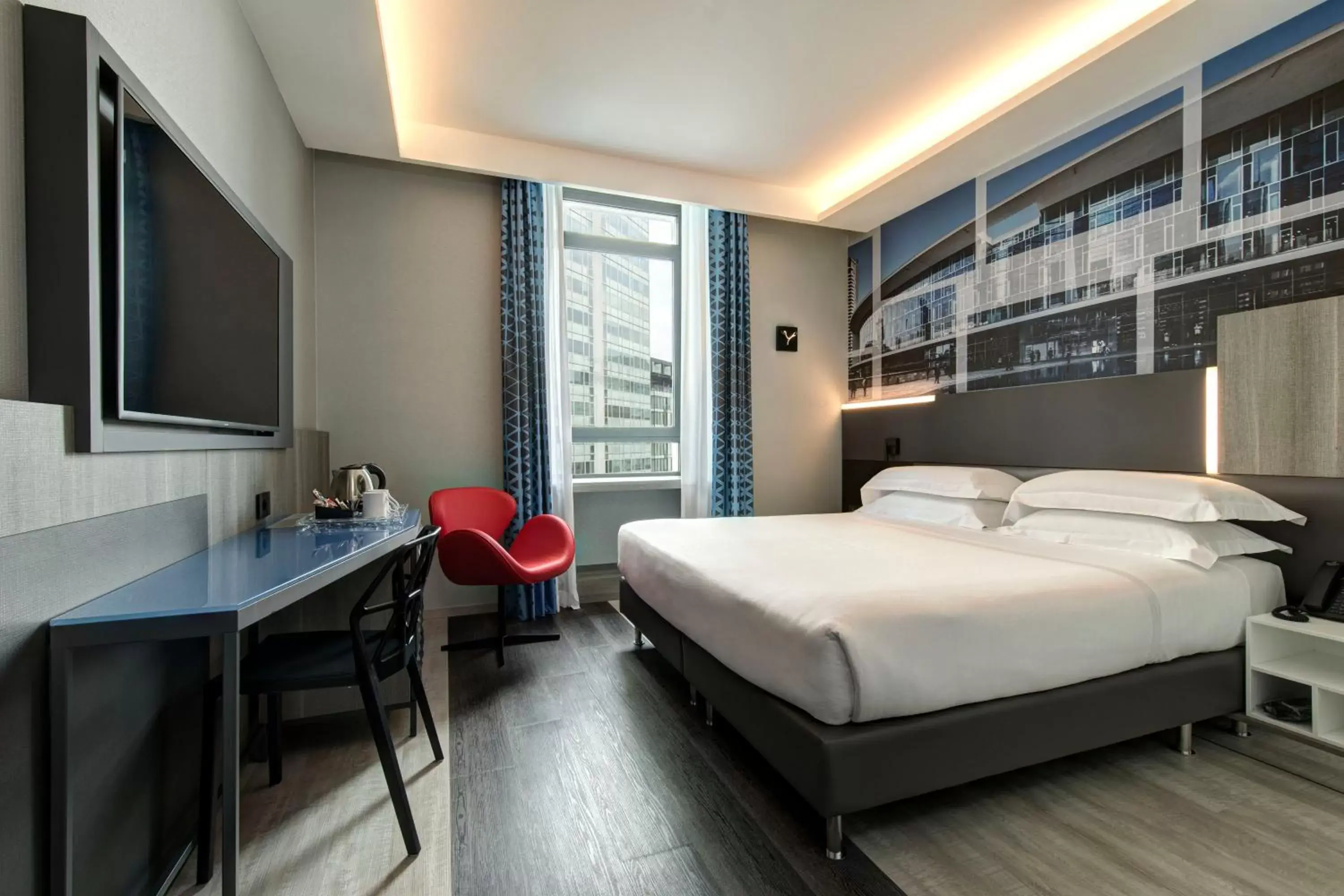 Bed in iQ Hotel Milano
