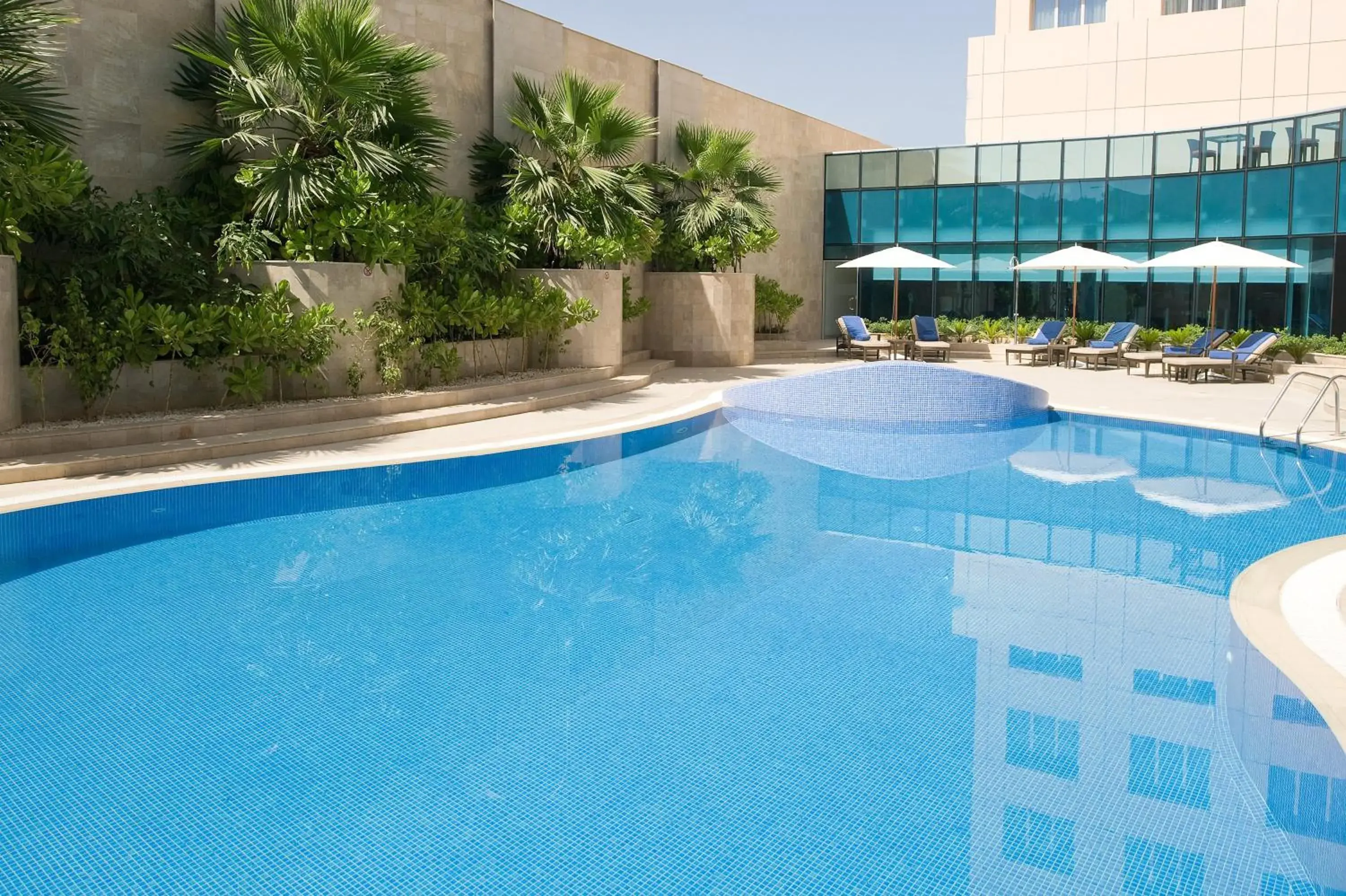 Swimming pool in Holiday Inn Muscat AlSeeb by IHG Swimming pool in Holiday Inn Muscat AlSeeb by IHG
