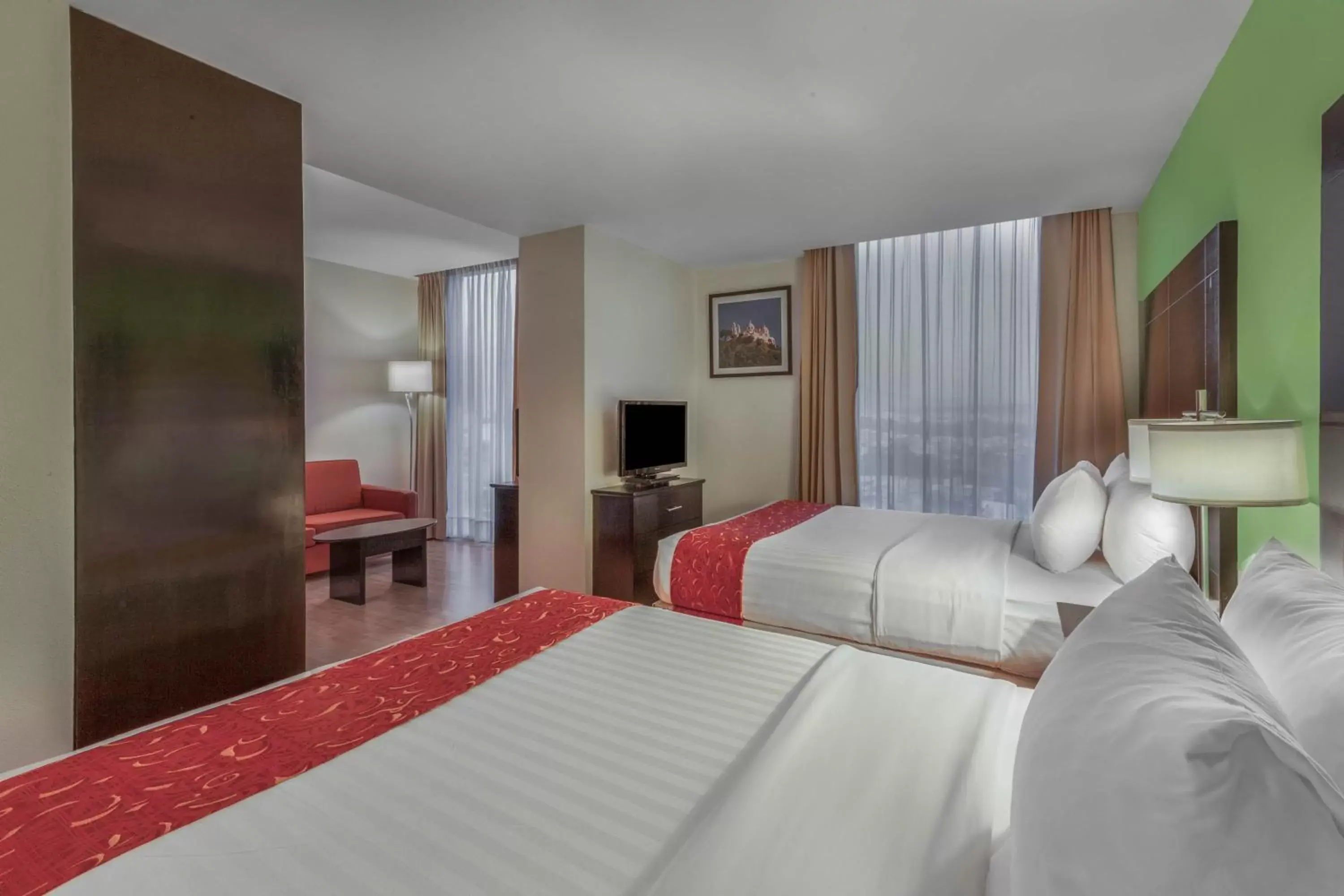 Photo of the whole room, Bed in La Quinta by Wyndham Puebla Palmas Angelopolis