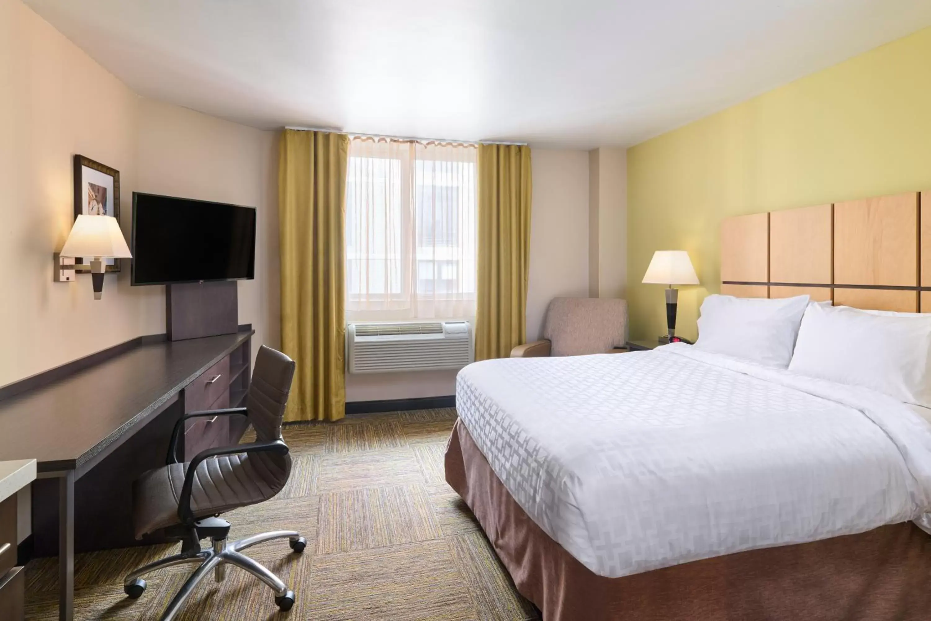 Bed, TV/Entertainment Center in Candlewood Suites NYC -Times Square, an IHG Hotel
