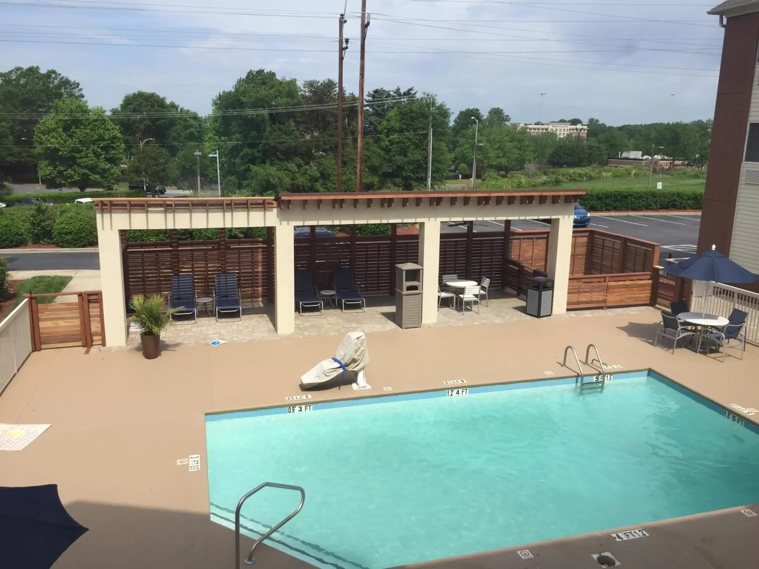 Patio, Pool View in Candlewood Suites - Charlotte - Arrowood, an IHG Hotel