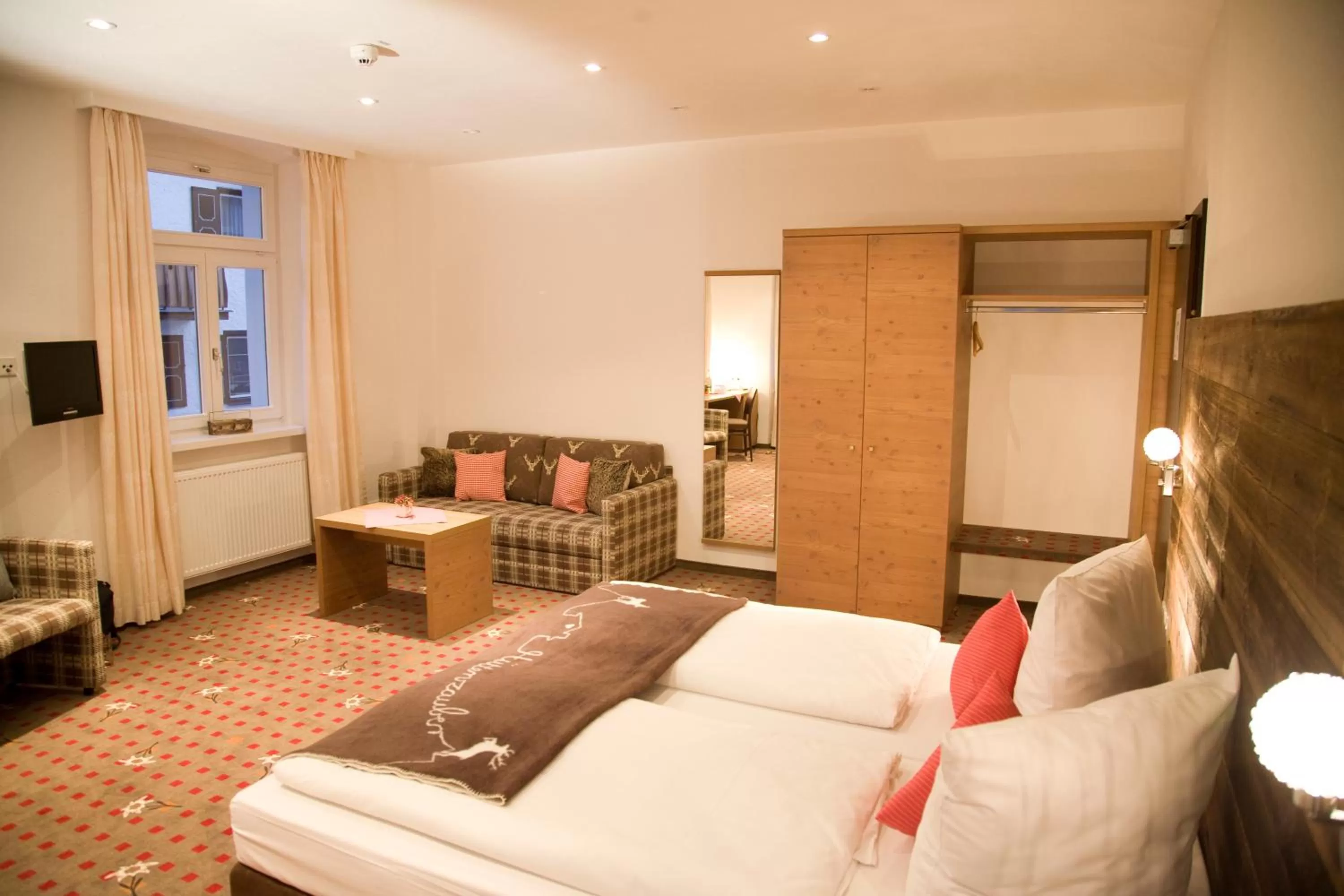 Photo of the whole room, Bed in Alpin Lifestyle Hotel Löwen & Strauss