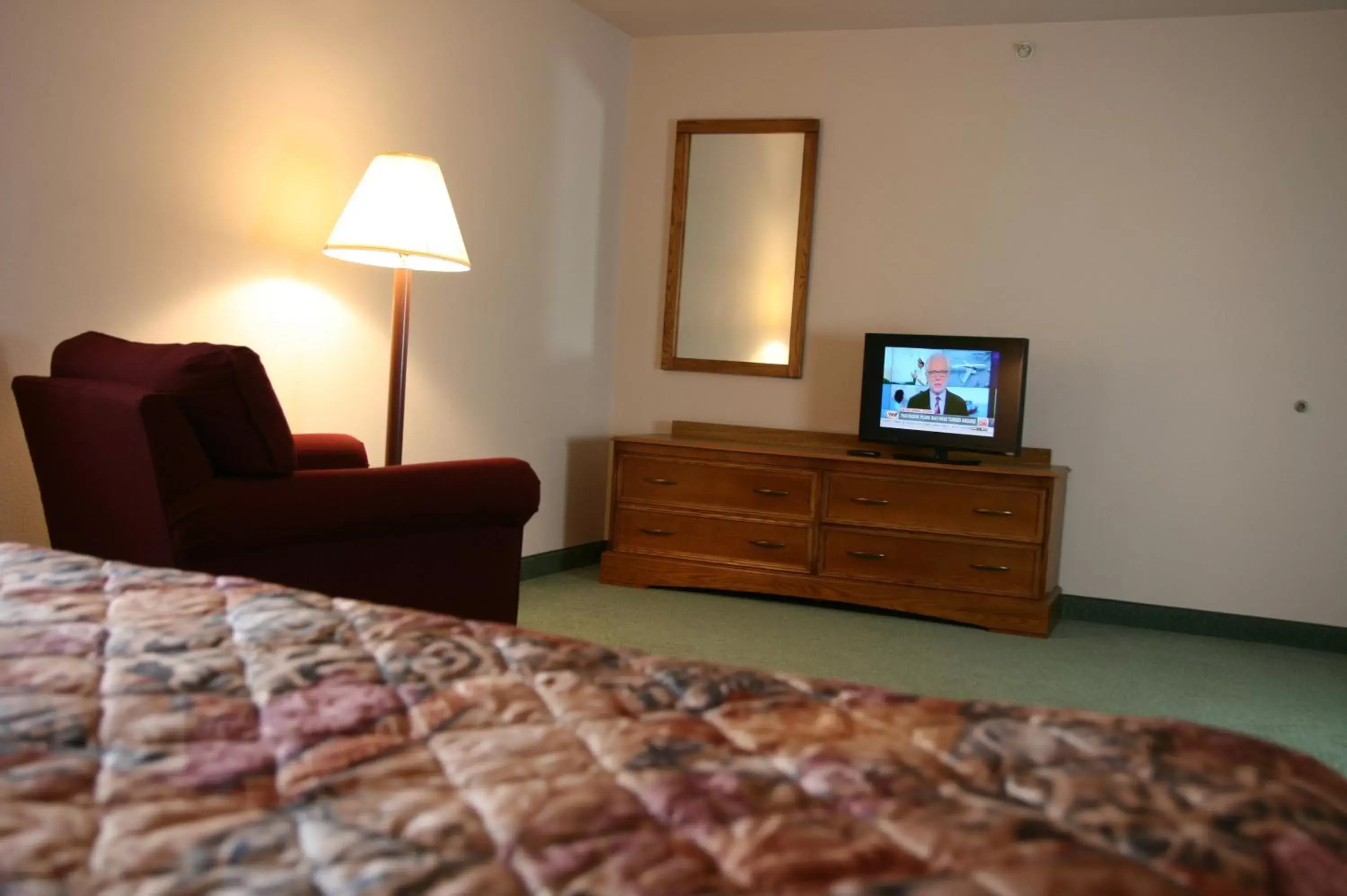 Bedroom, TV/Entertainment Center in Affordable Suites Rocky Mount