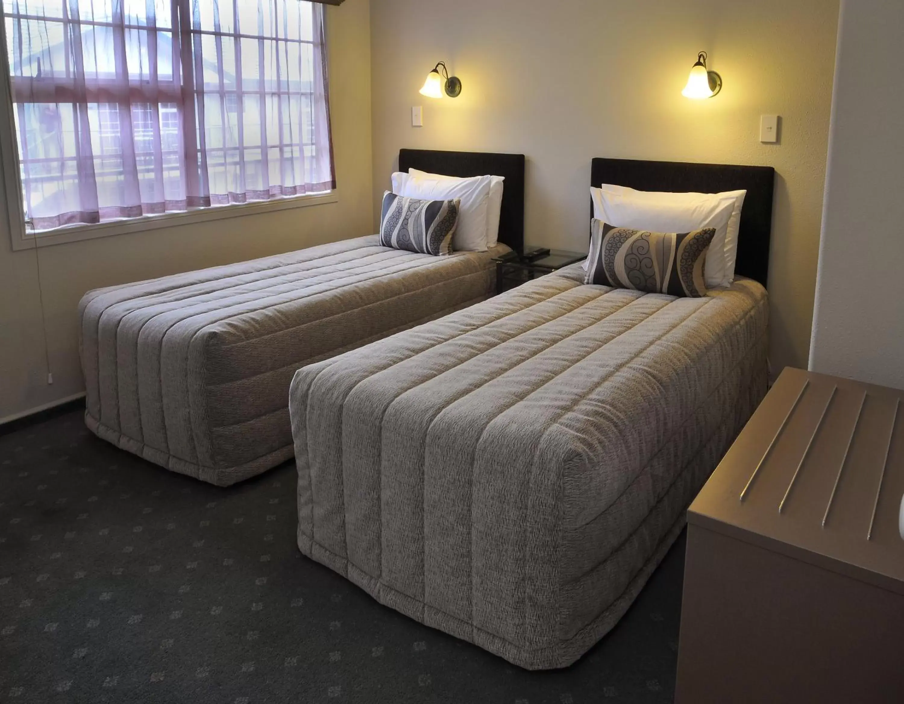 Bed in Silver Fern Rotorua Suites & Spa