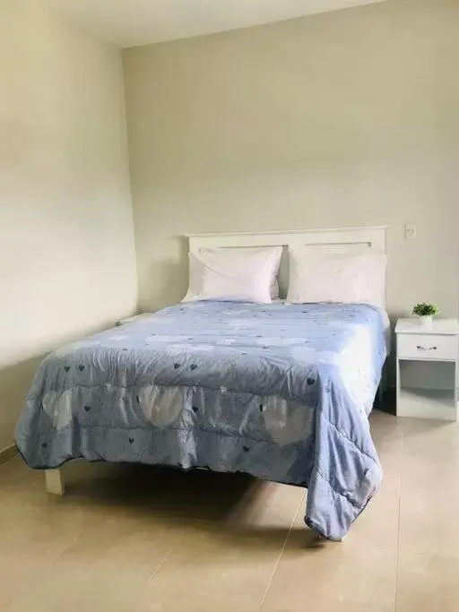 Bed in Apartahotel MACADANA