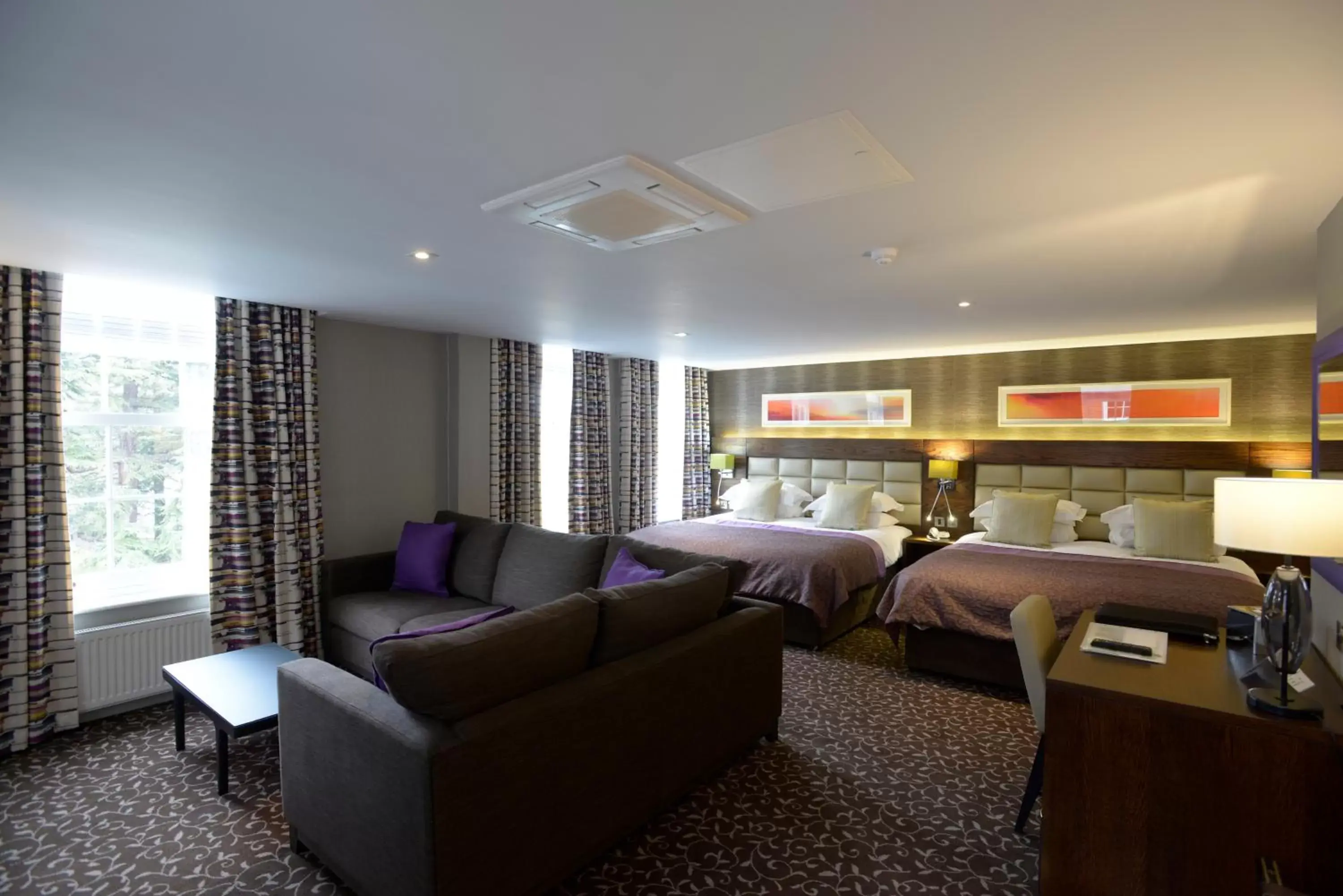 Bed, Seating Area in The Lensbury Resort