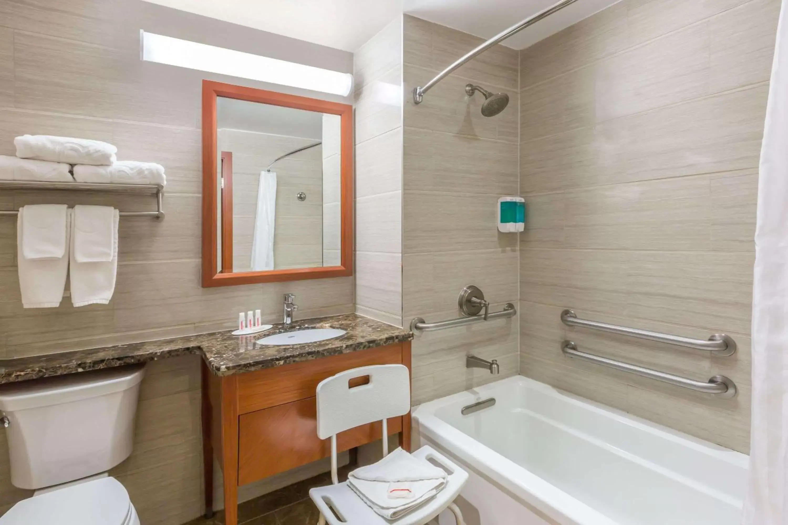 Bathroom in Ramada by Wyndham Flushing Queens