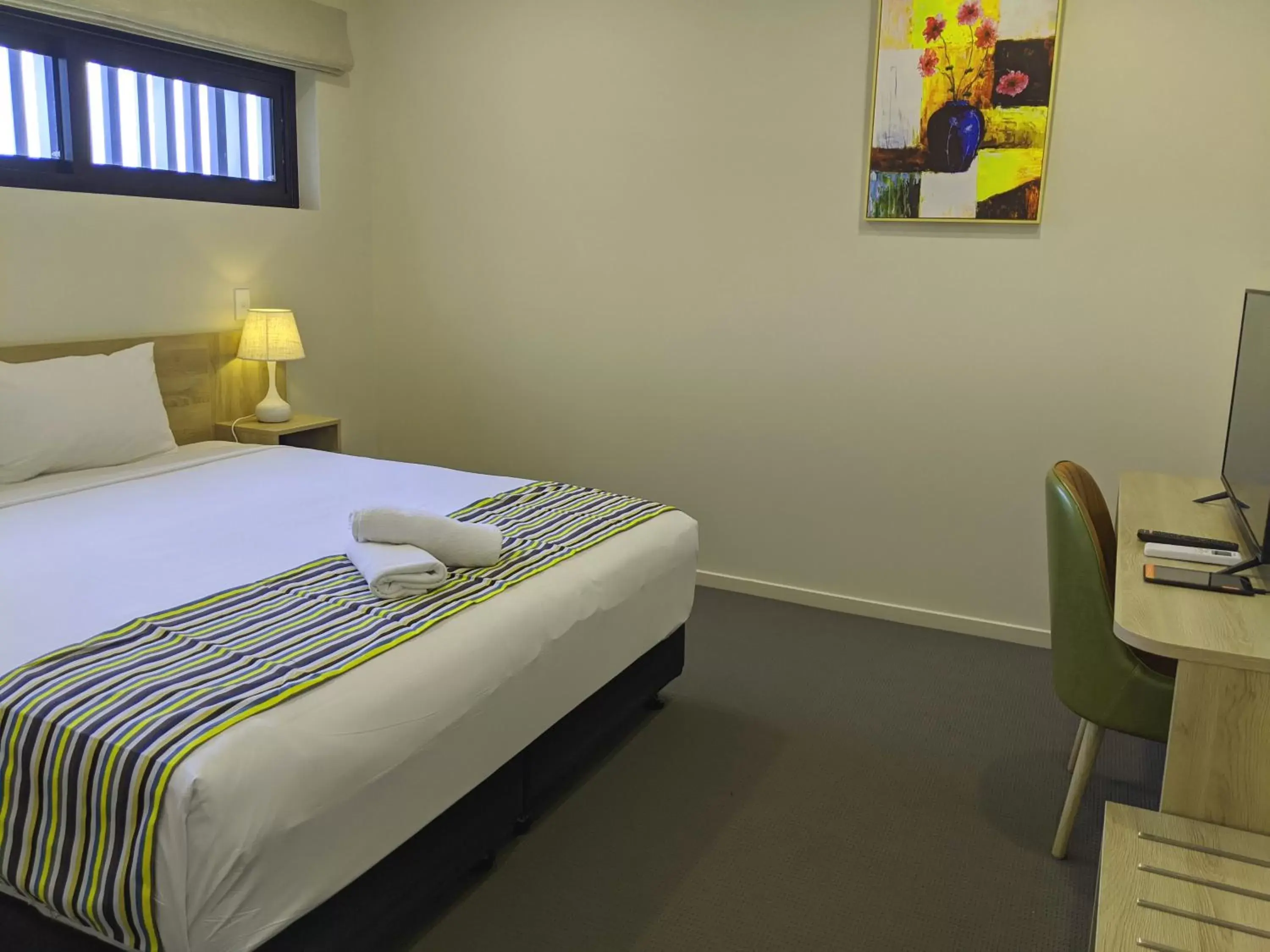 Bed in The Windsor Apartments and Hotel Rooms, Brisbane