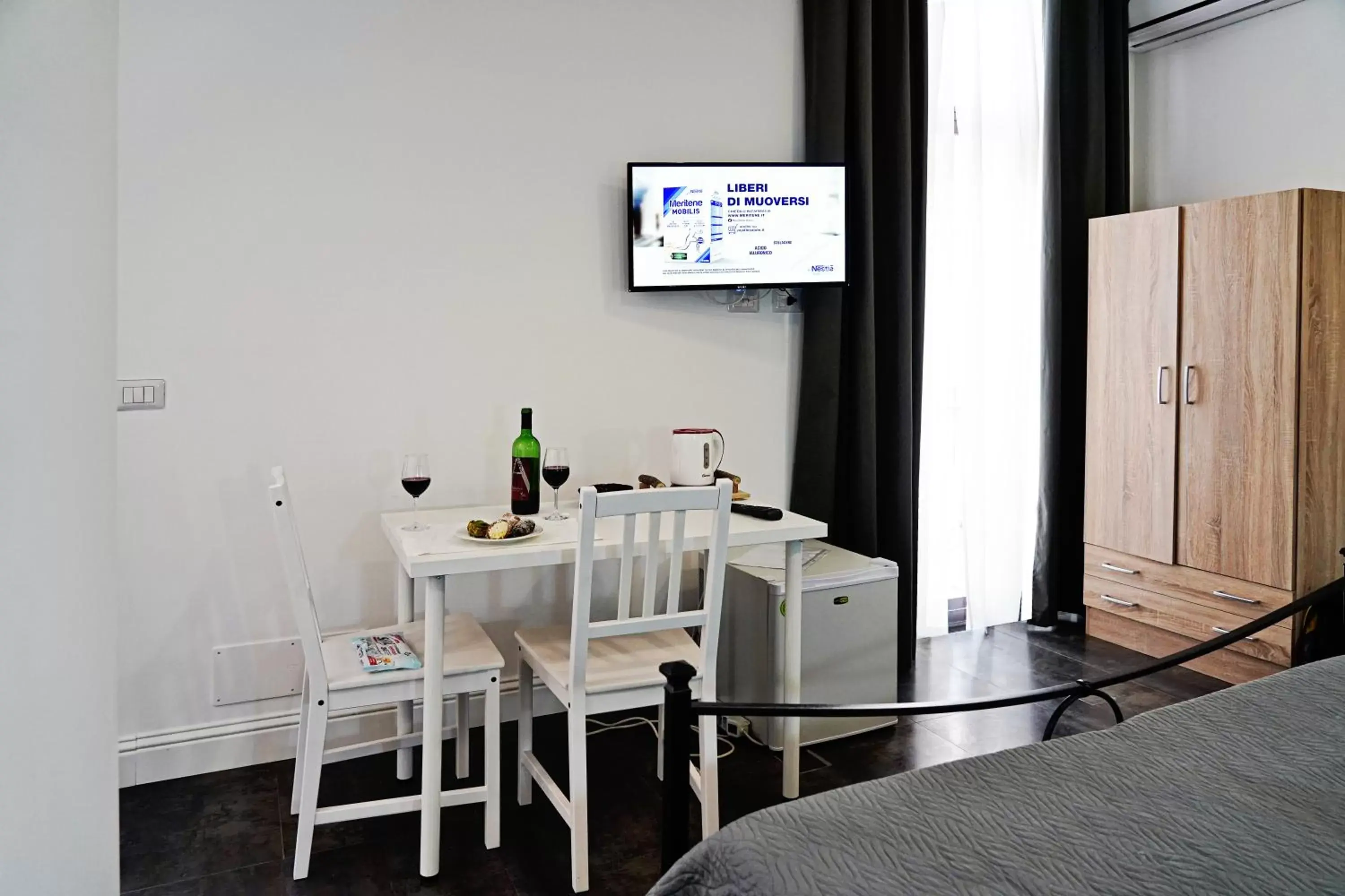 TV and multimedia, TV/Entertainment Center in B&B Giardino Bellini-centro