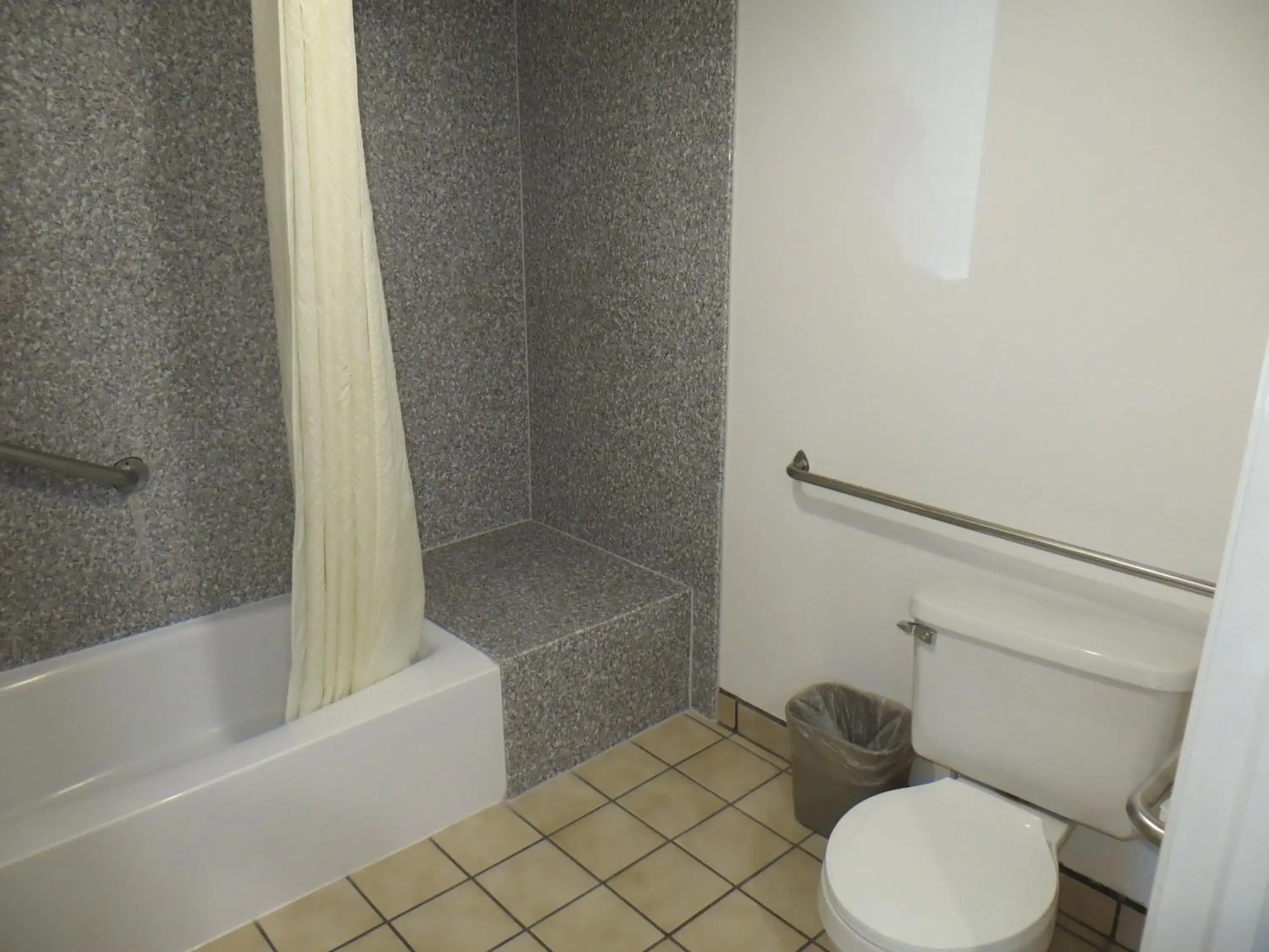 Toilet, Bathroom in Riverside Inn & Suites