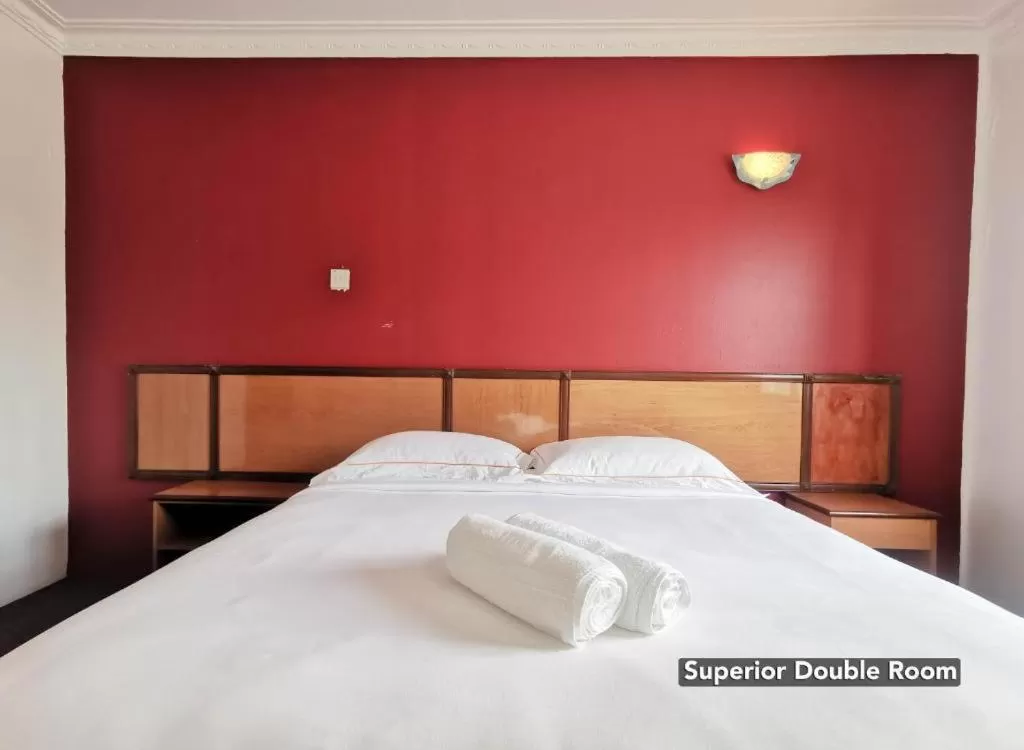 Bed in THE ZULEY HERITAGE HOTEL