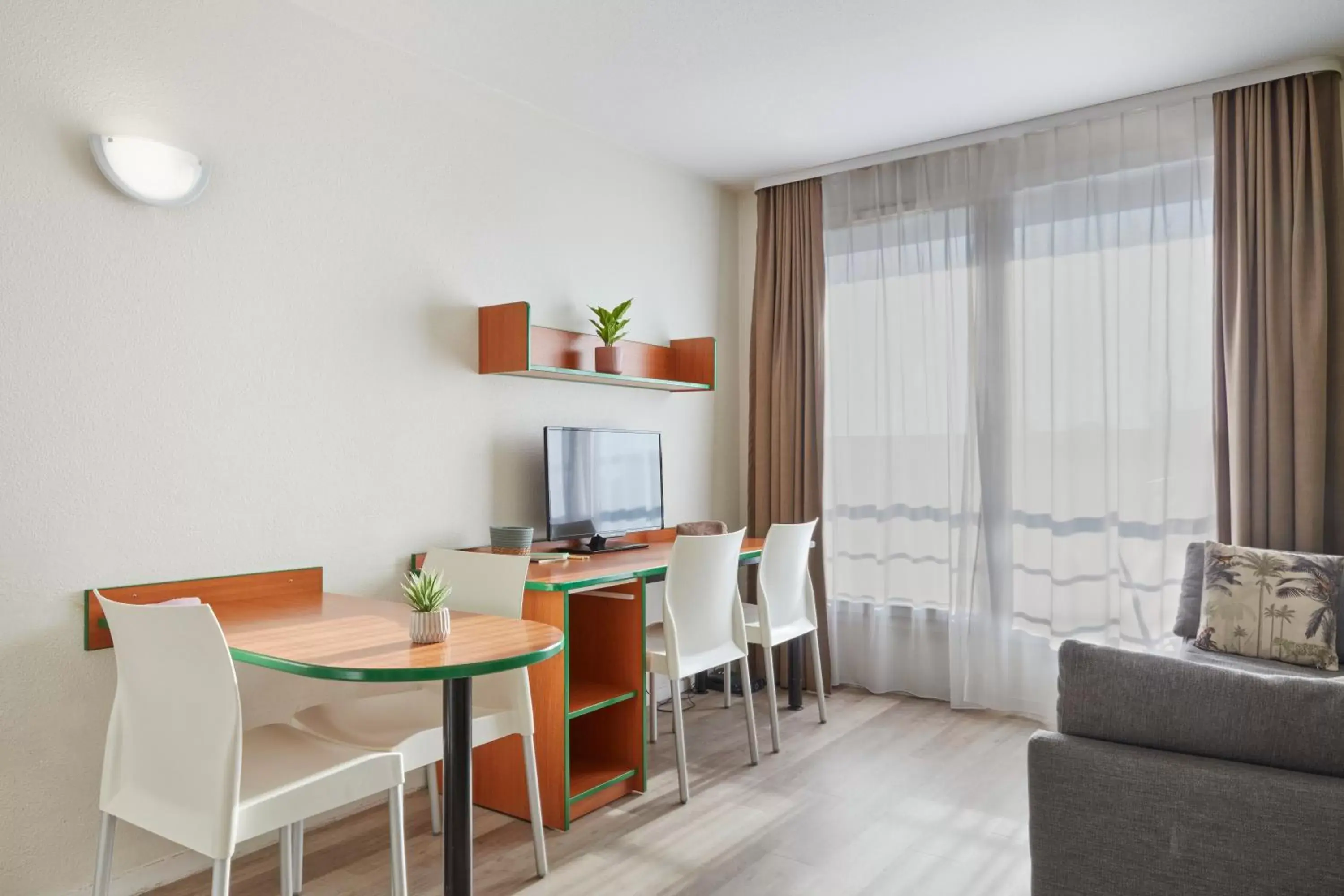 Living room in Aparthotel Adagio Access Bordeaux Rodesse Living room in Aparthotel Adagio Access Bordeaux Rodesse