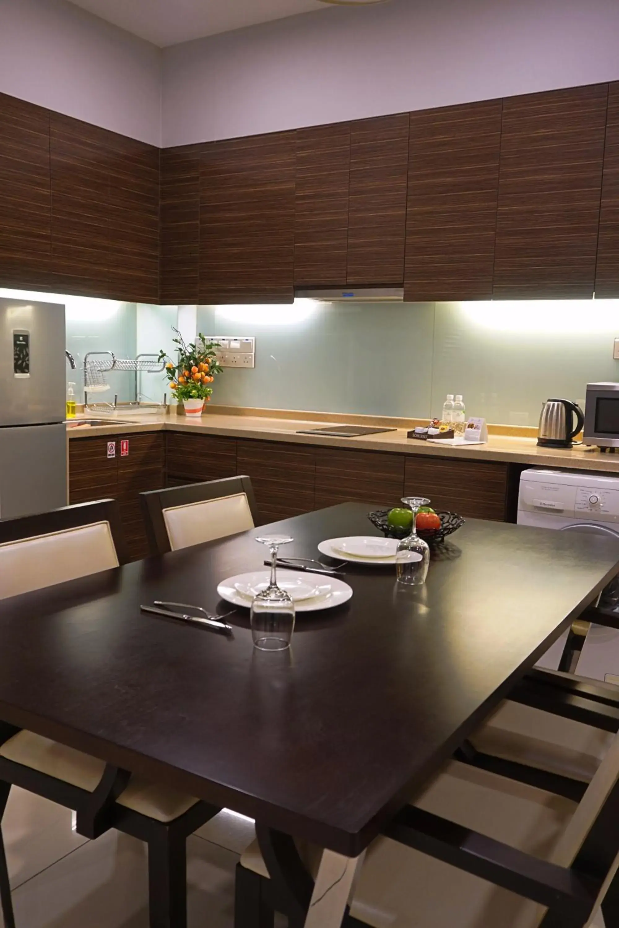 Communal kitchen, Dining Area in Trinidad Suites Johor, Trademark Collection by Wyndham