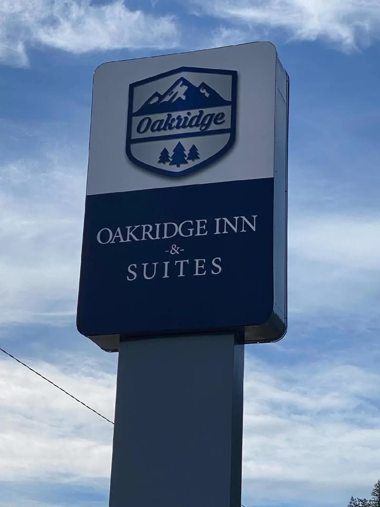 Property logo or sign in Oakridge Inn & Suites