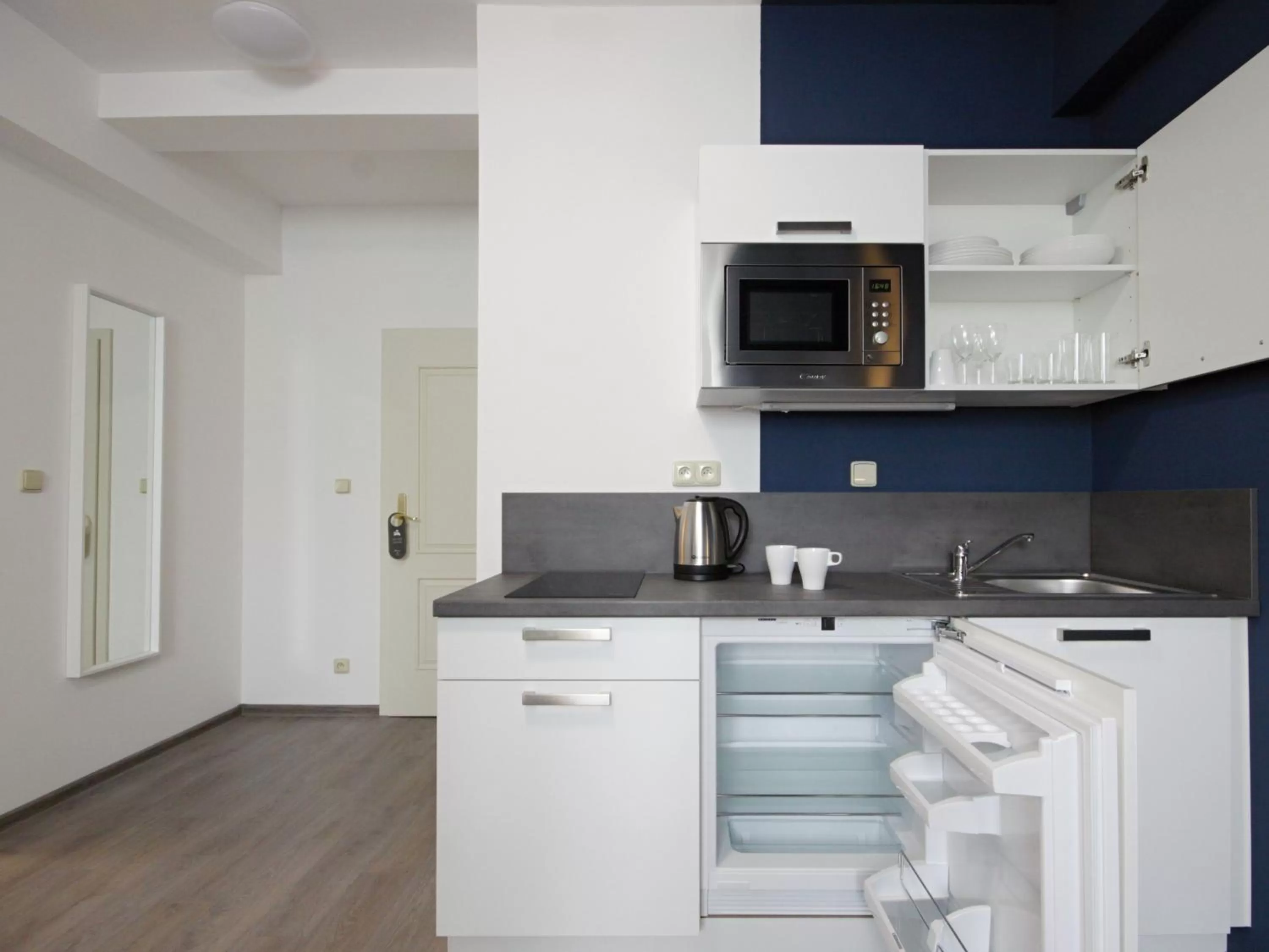 Kitchen or kitchenette in Alveo Suites