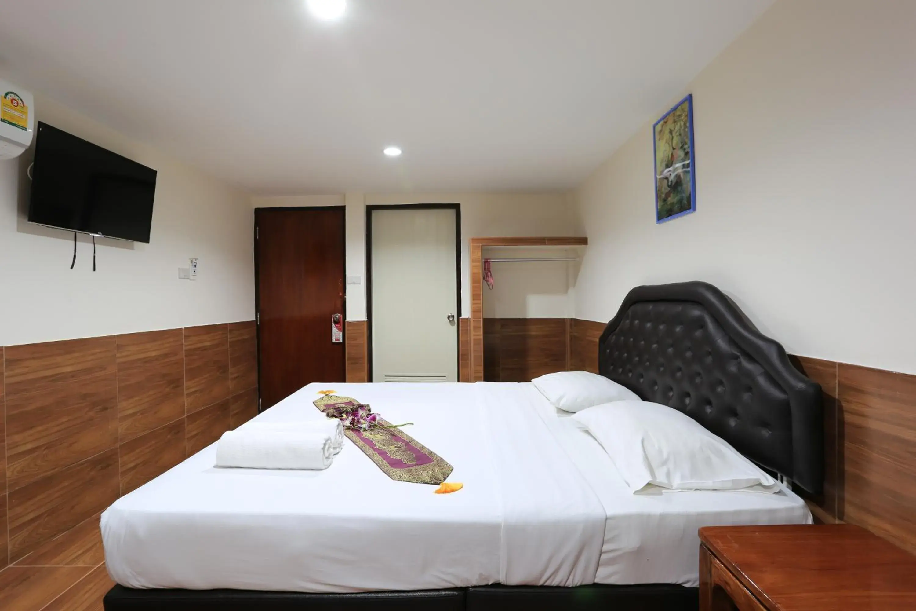 Bed in The Siam Guest House - SHA Extra Plus Bed in The Siam Guest House - SHA Extra Plus