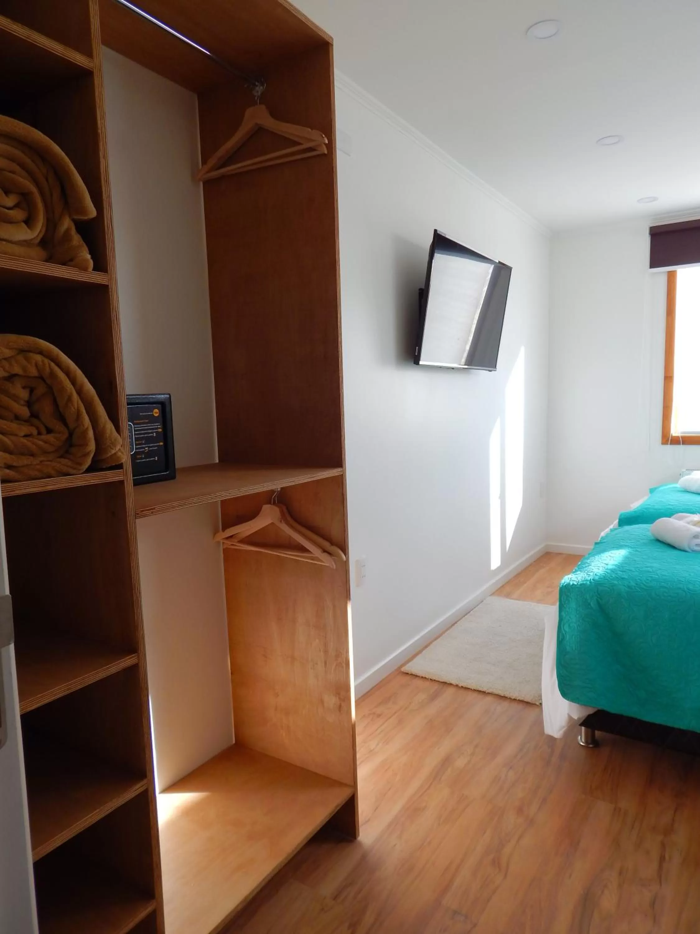 Bed, TV/Entertainment Center in Hostal Buenavista Patagonia