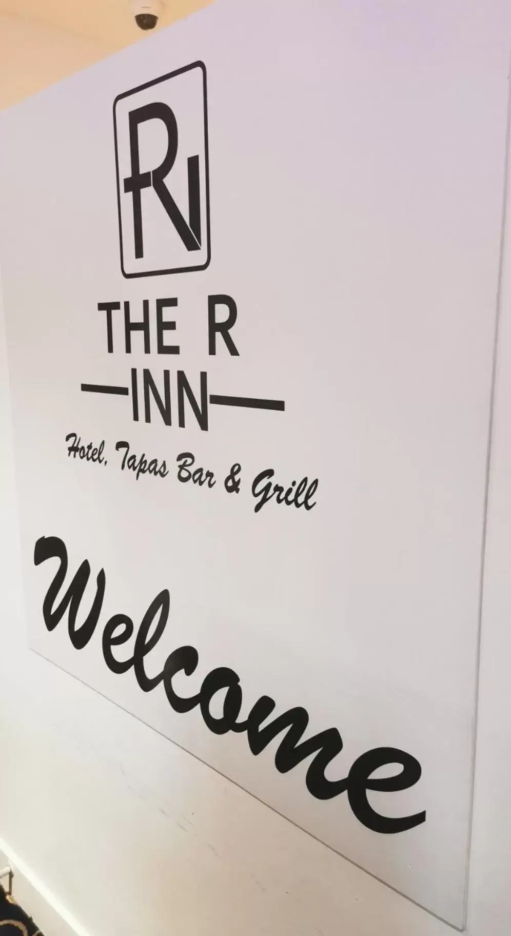 Property logo or sign in The R Inn Hotel