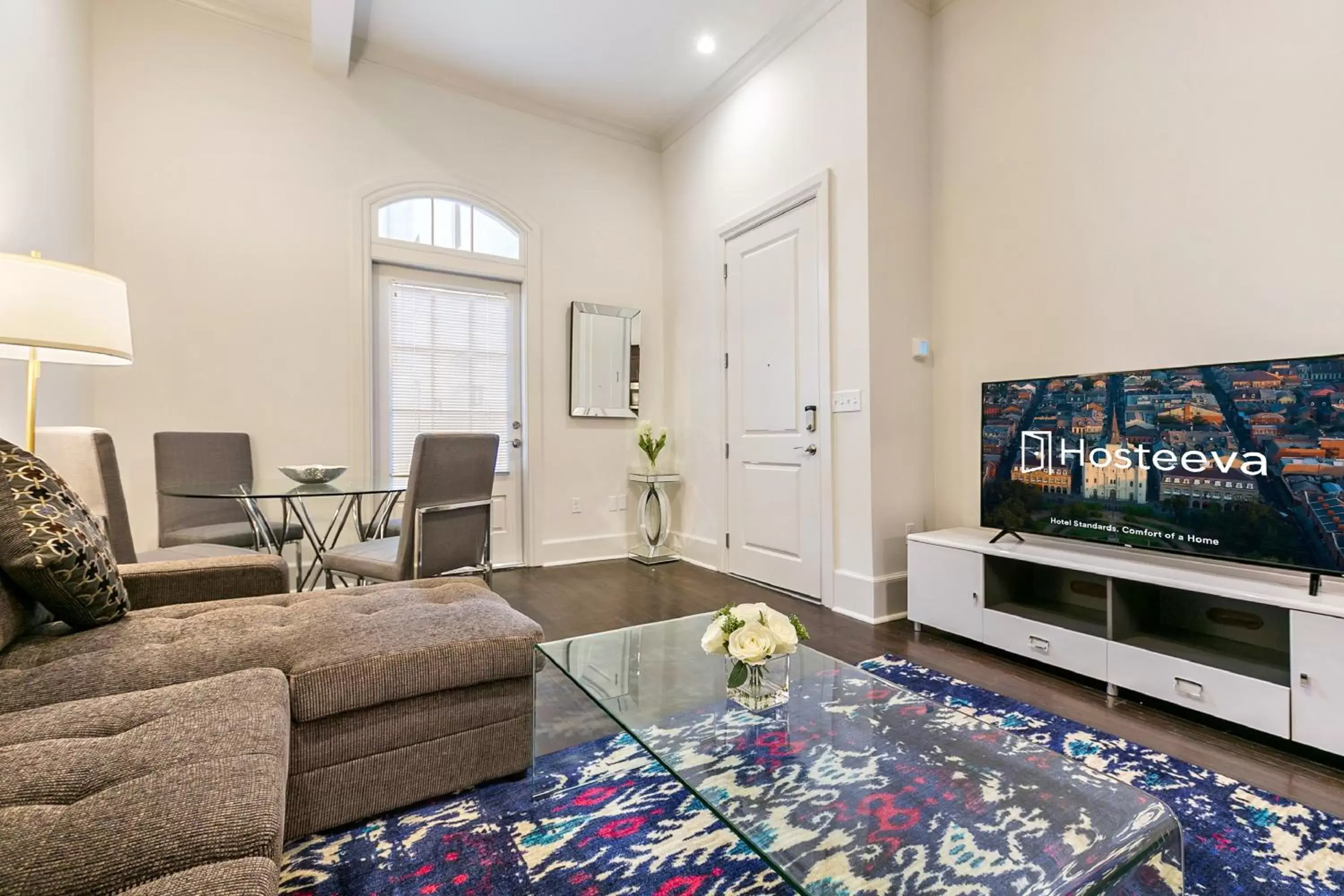 Living room, TV/Entertainment Center in 1 and 2 BR Private Condos Steps Away From French Quarter
