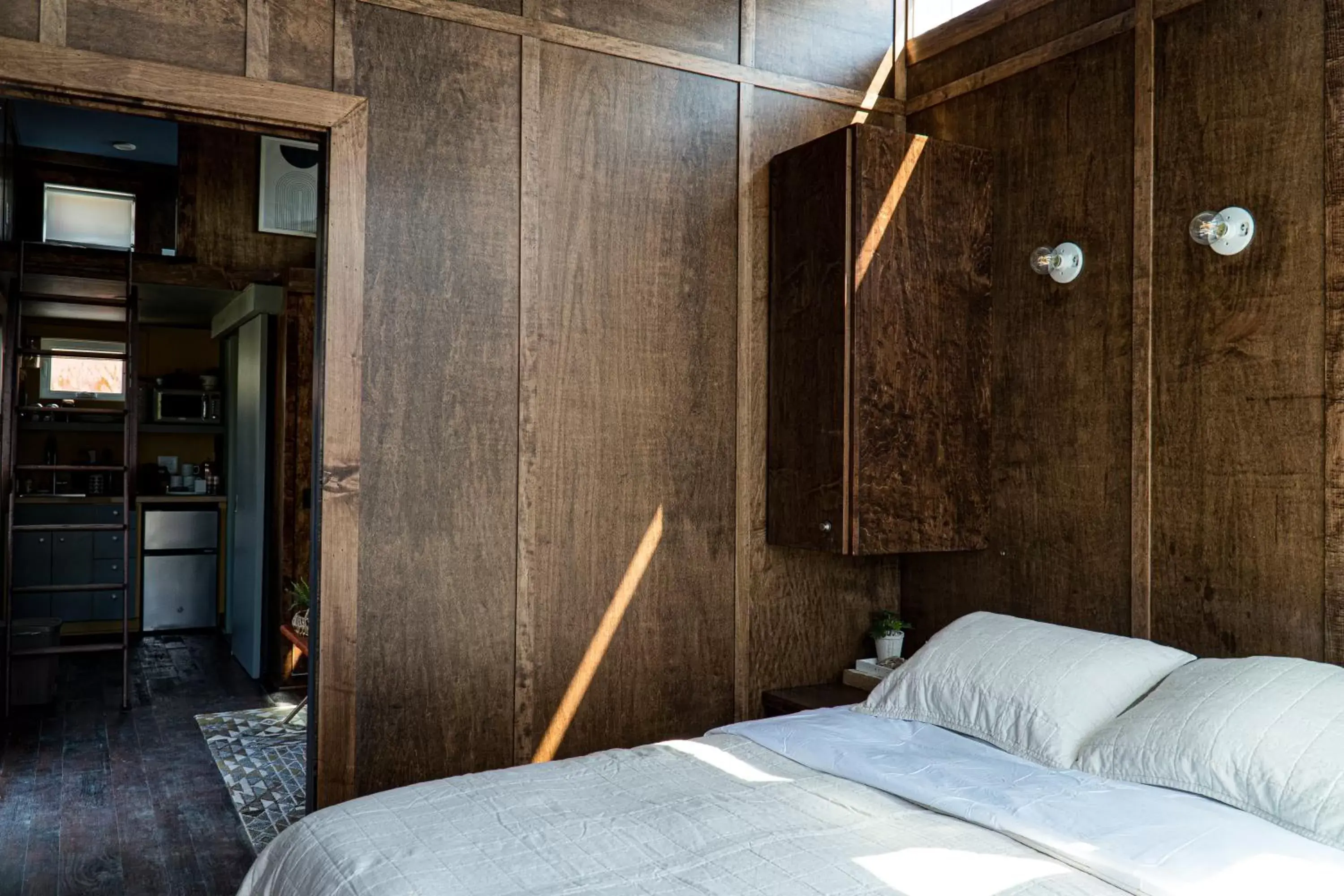 Bed in Ironwood Grove, Tiny House Hotel