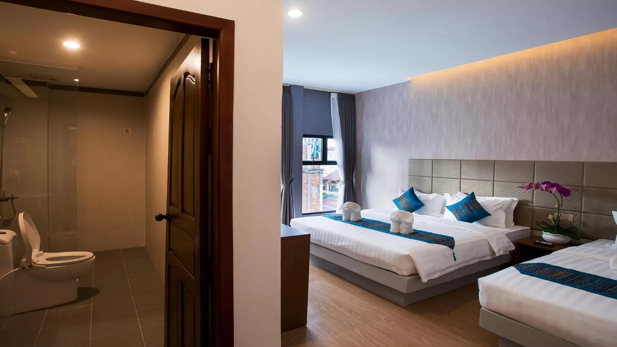 Photo of the whole room, Bed in Orussey One Boutique