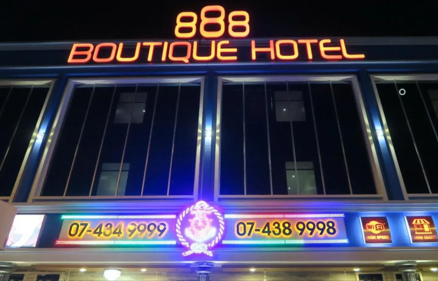 Night, Property Logo/Sign in 888 Boutique Hotel