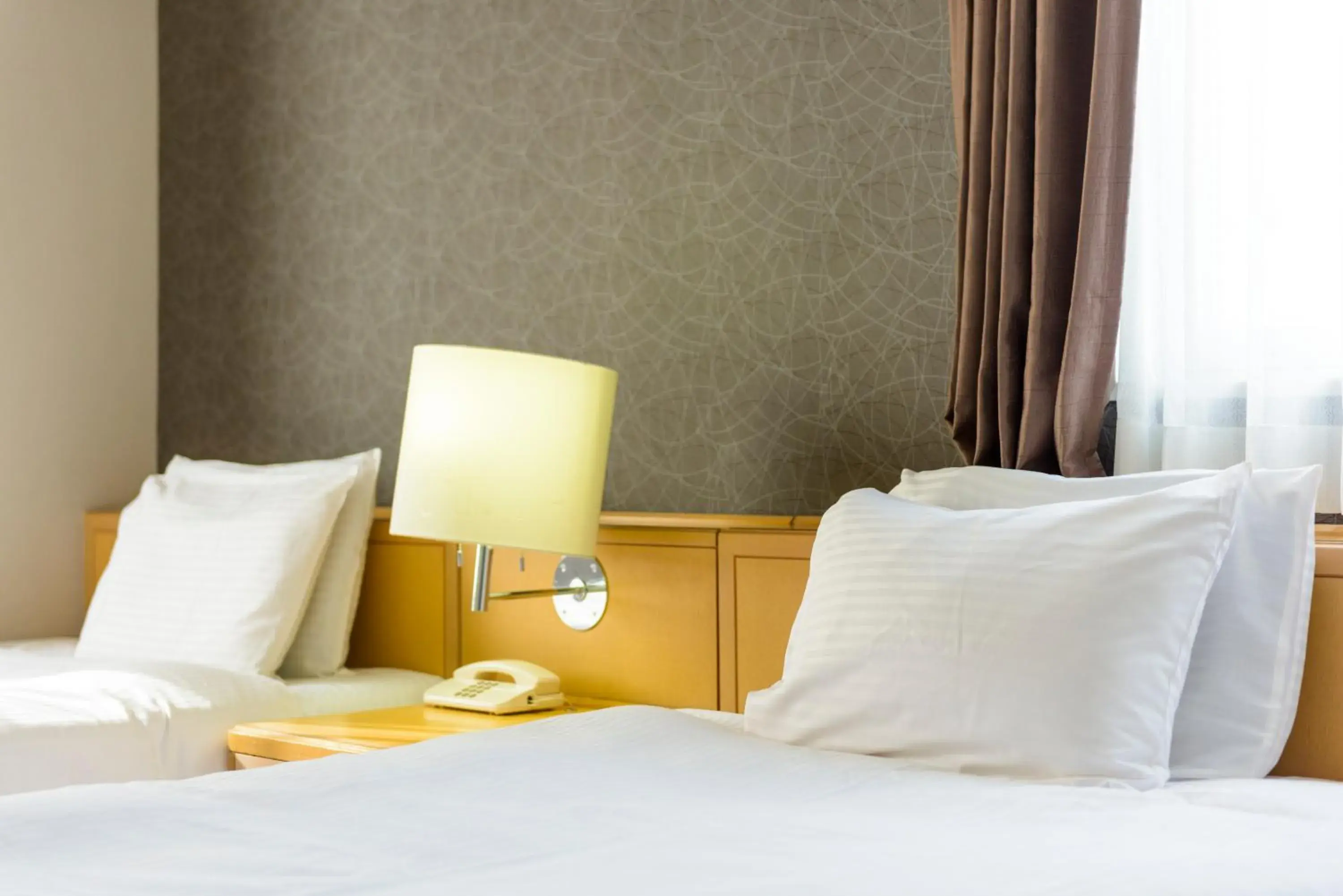 Bed in SureStay Plus Hotel by Best Western Shin-Osaka