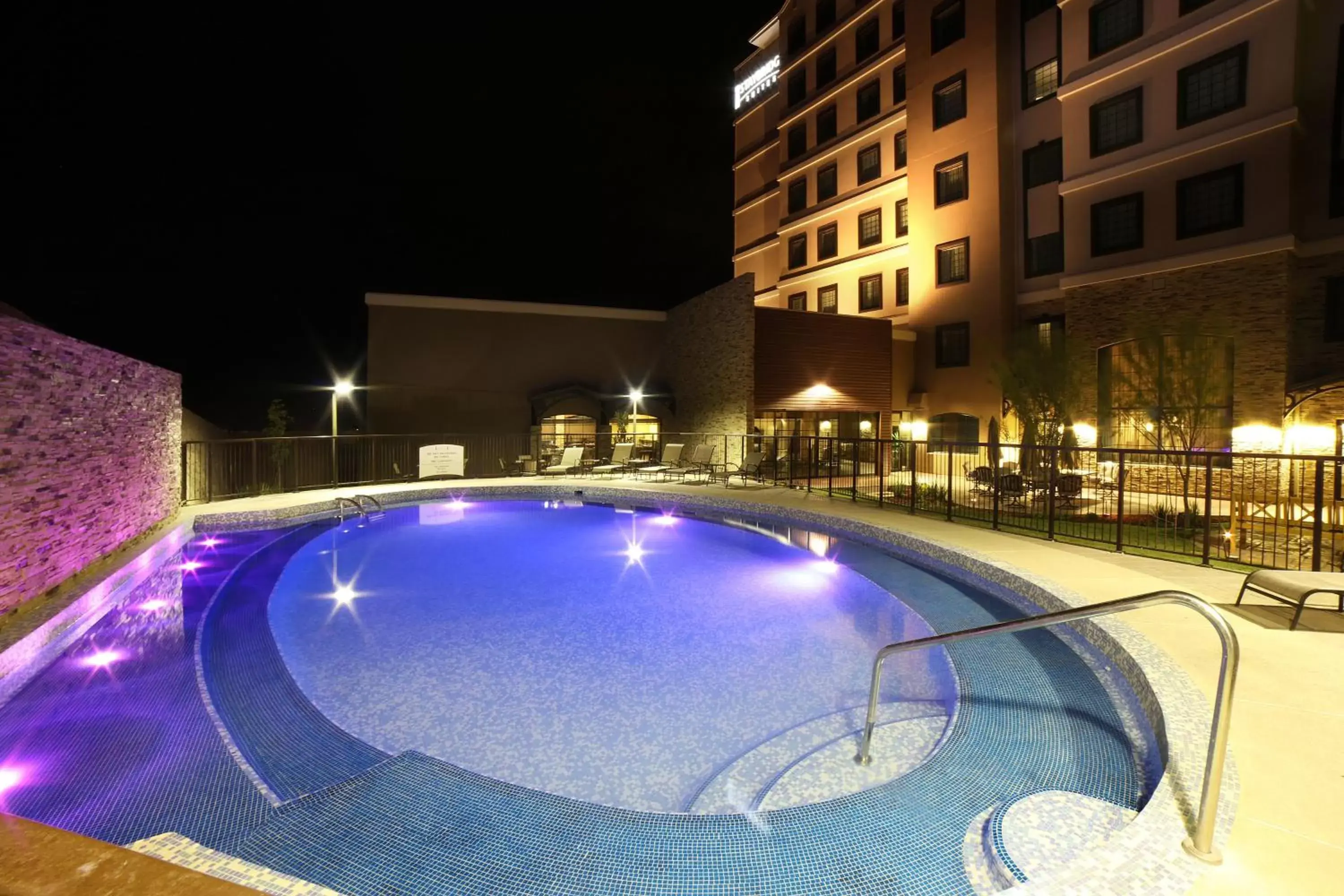 Swimming pool, Property Building in Staybridge Suites Chihuahua, an IHG Hotel