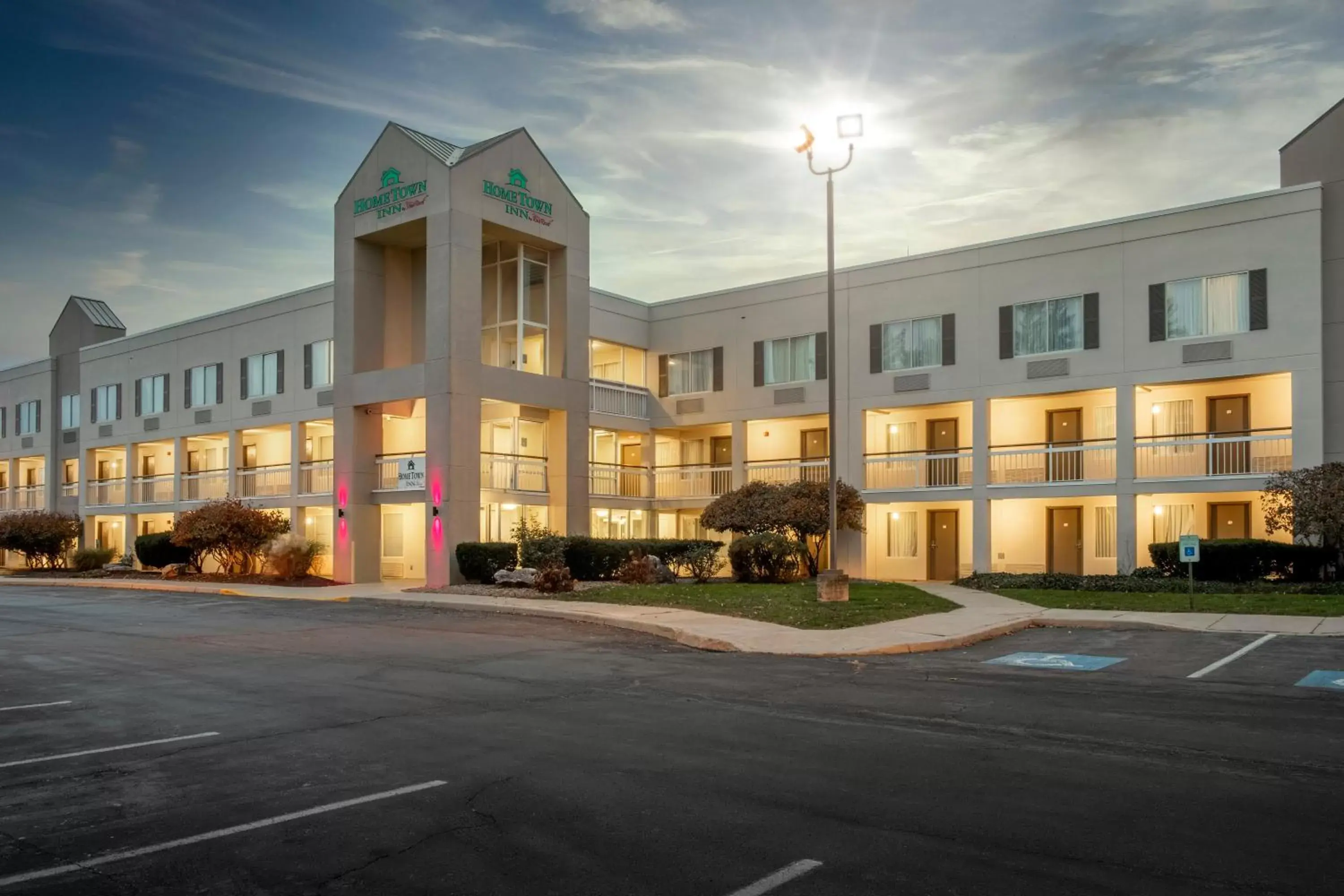 Property building in HomeTown Inn by Red Roof East Syracuse