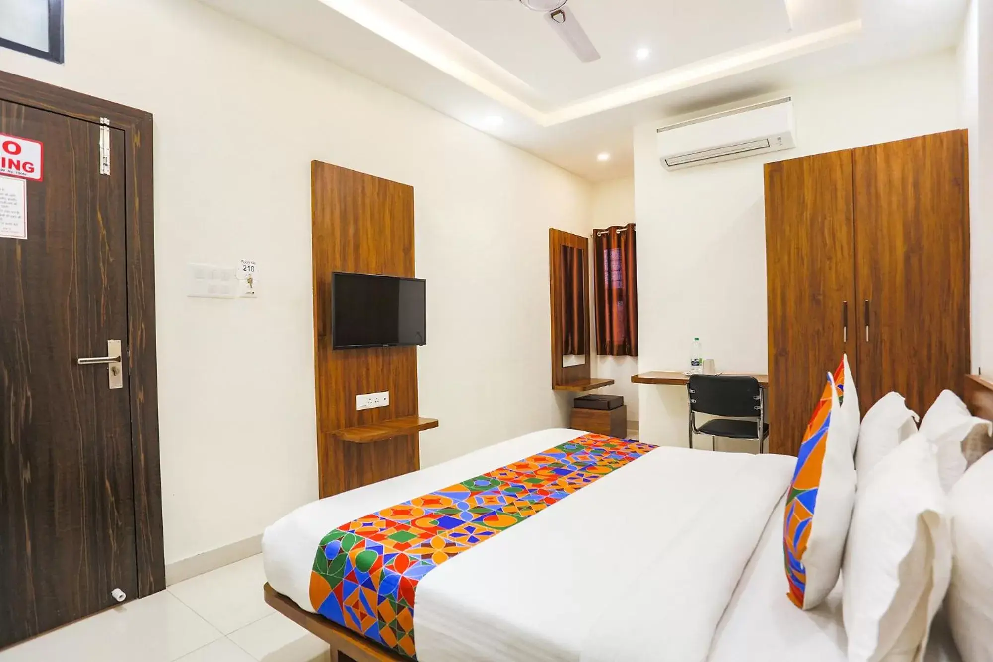 Bed in FabHotel Balaji Paradise Bed in FabHotel Balaji Paradise