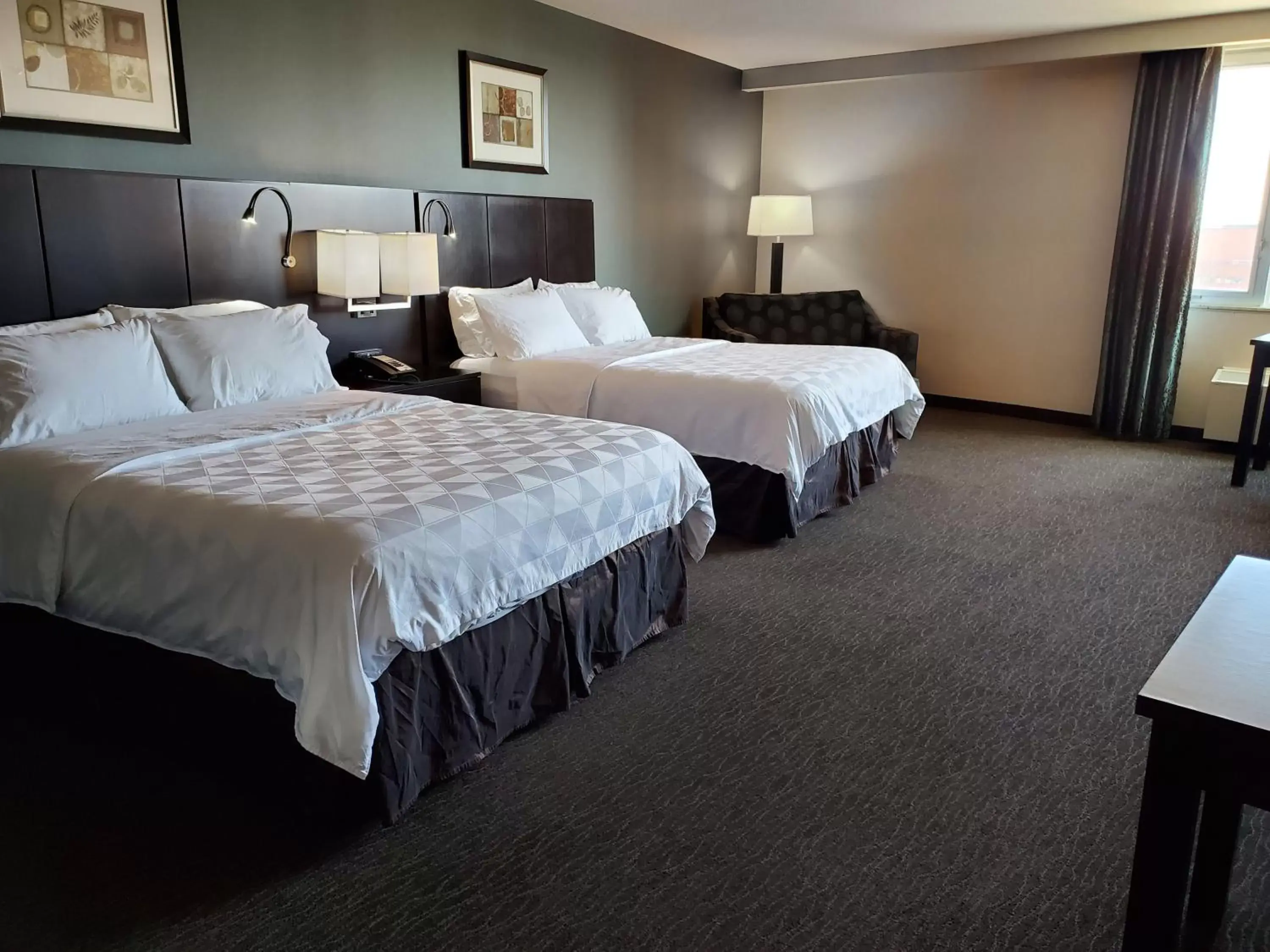 Bed in Holiday Inn Saskatoon Downtown, an IHG Hotel