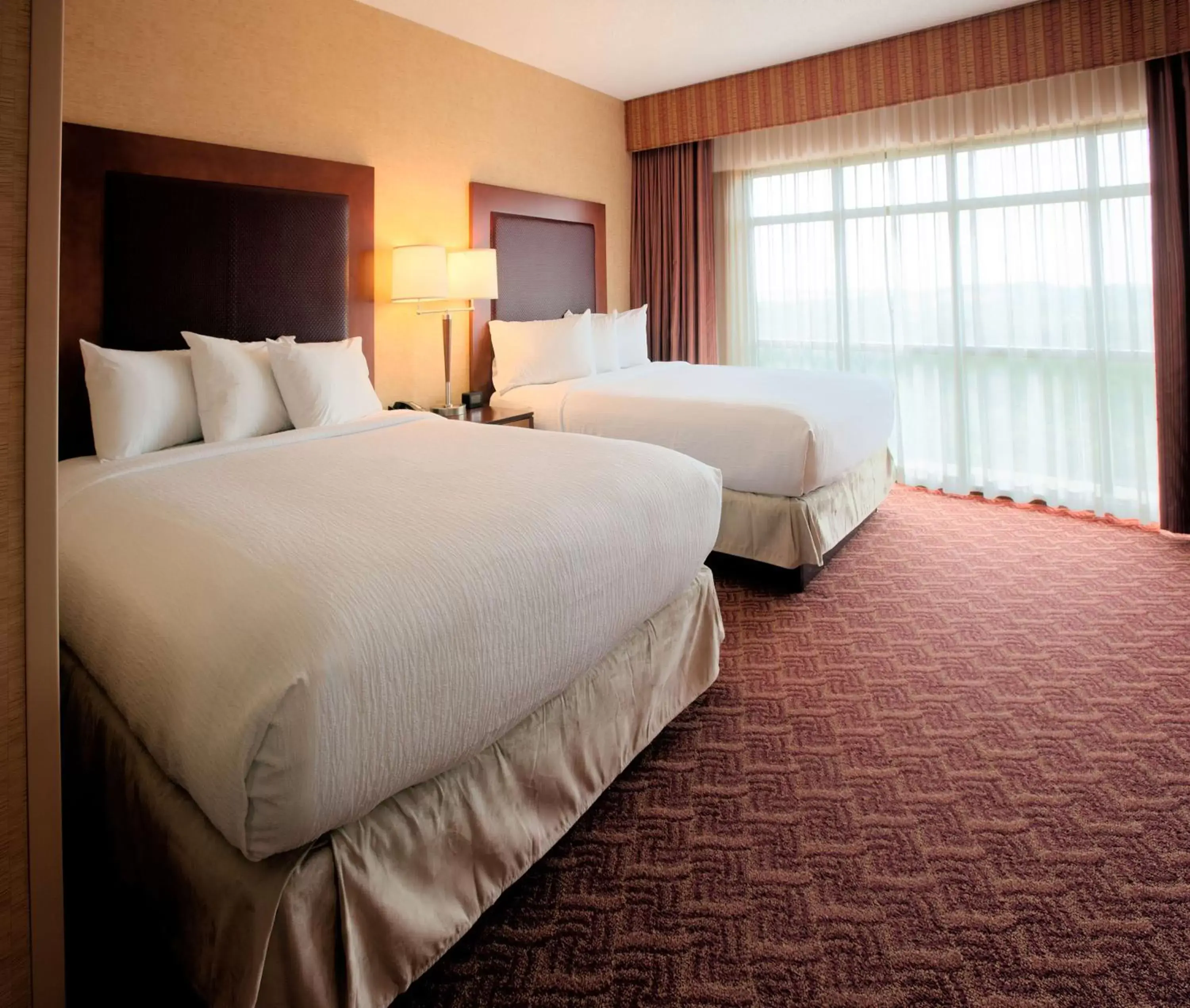 Bed in Embassy Suites by Hilton Charlotte Concord Golf Resort & Spa