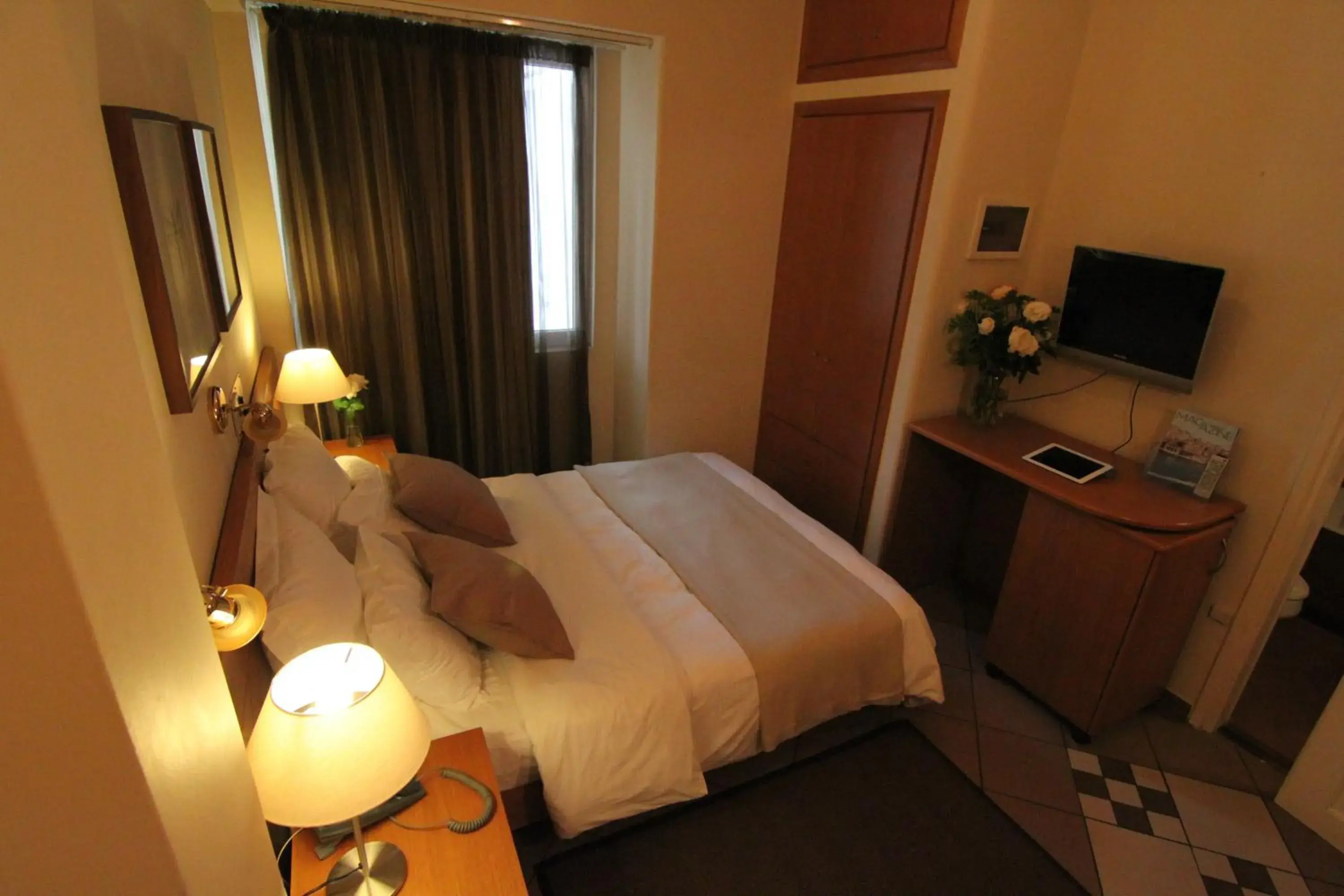Bed in Achillion Hotel