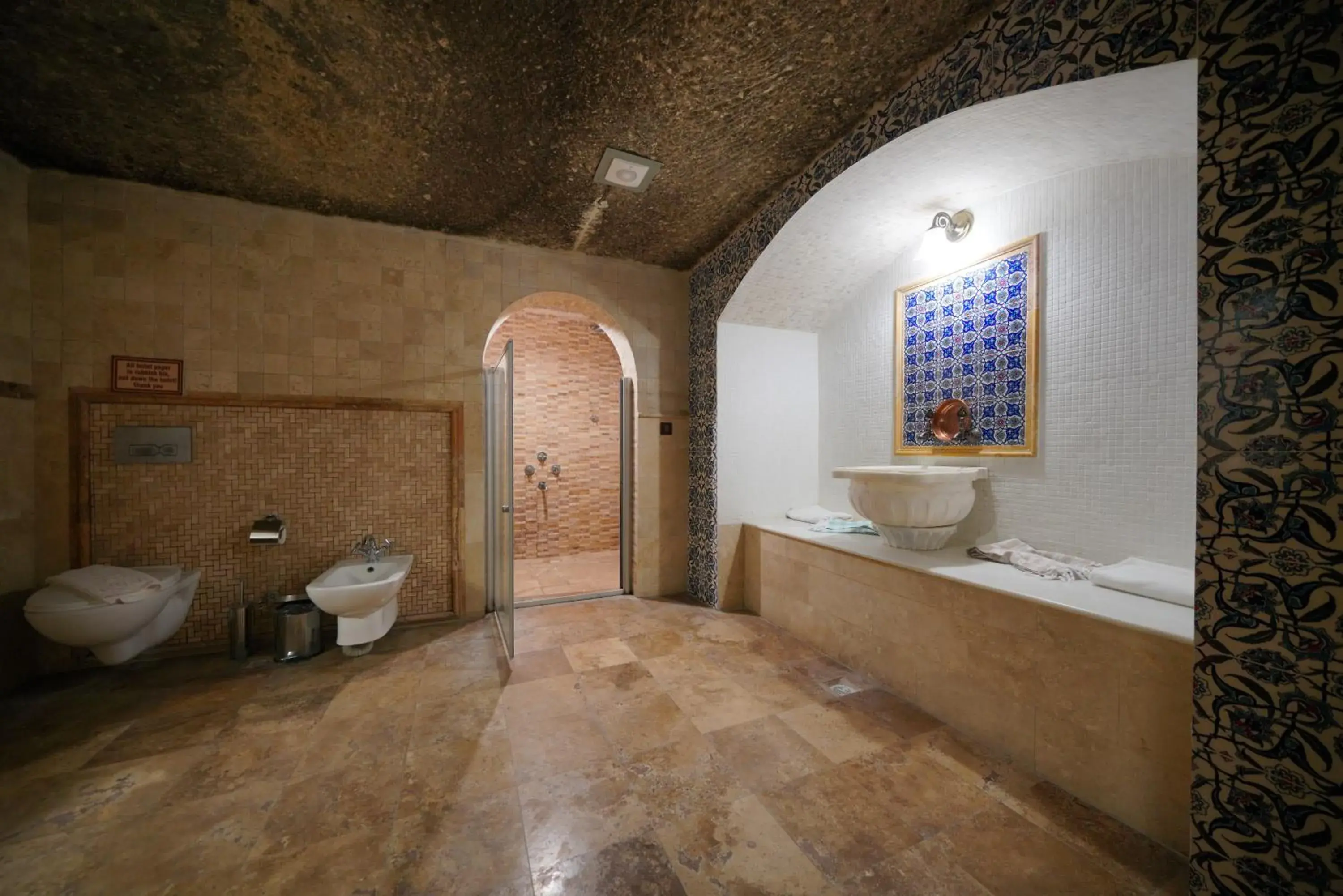 Toilet, Bathroom in Holiday Cave Hotel