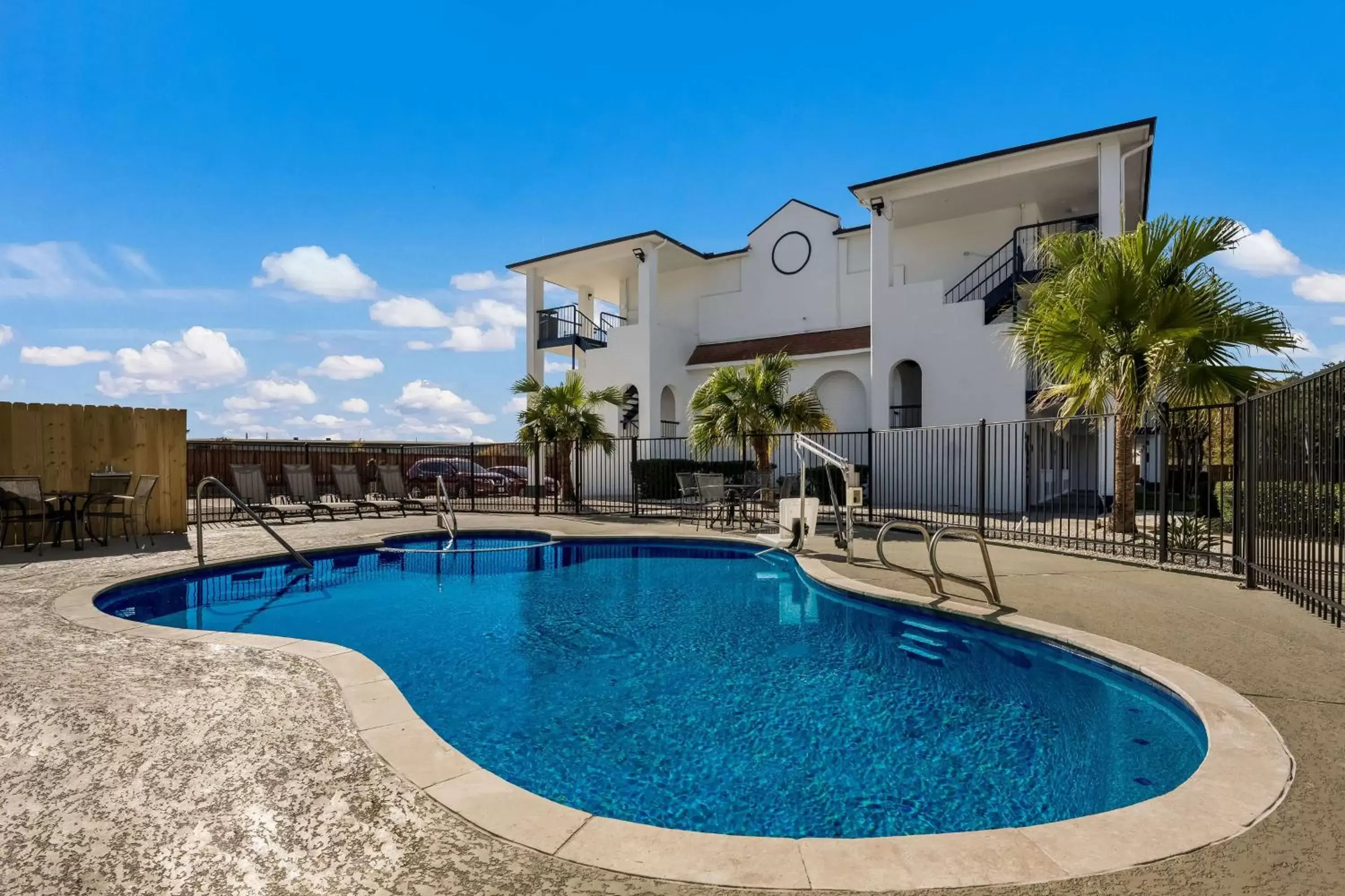 Pool view, Property Building in SureStay Hotel by Best Western Spring North Houston