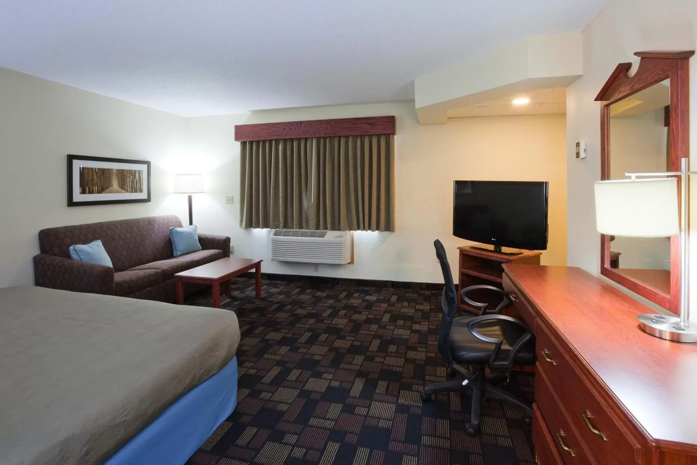 Photo of the whole room, TV/Entertainment Center in AmericInn by Wyndham Austin