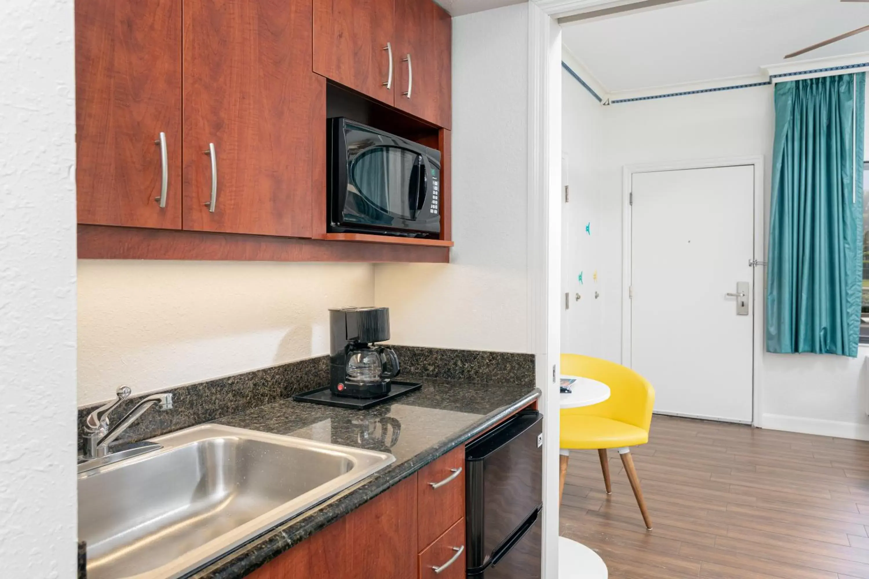 Kitchen/Kitchenette in Beachside Hotel and Suites