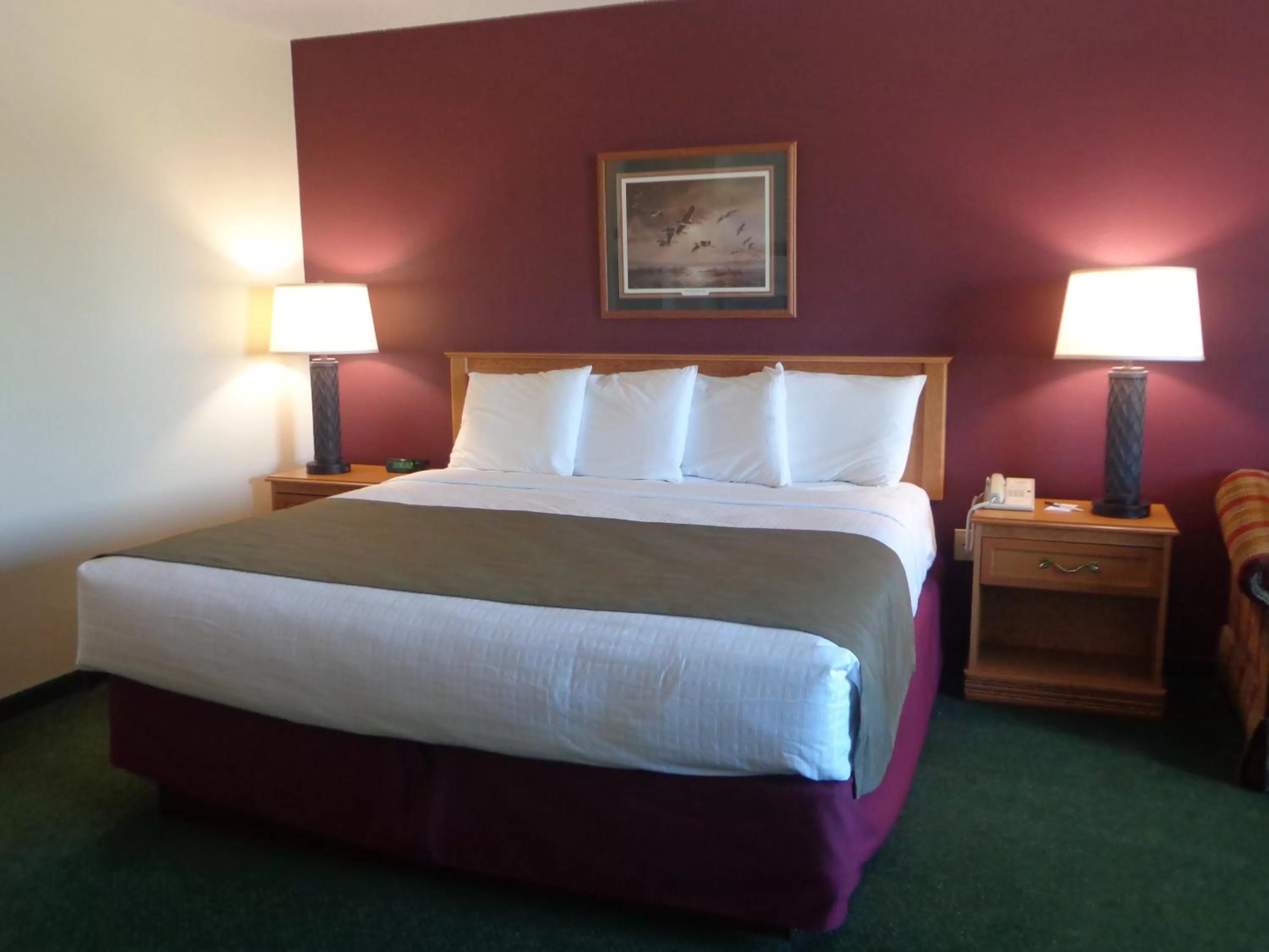 Bed in AmericInn by Wyndham Madison SD