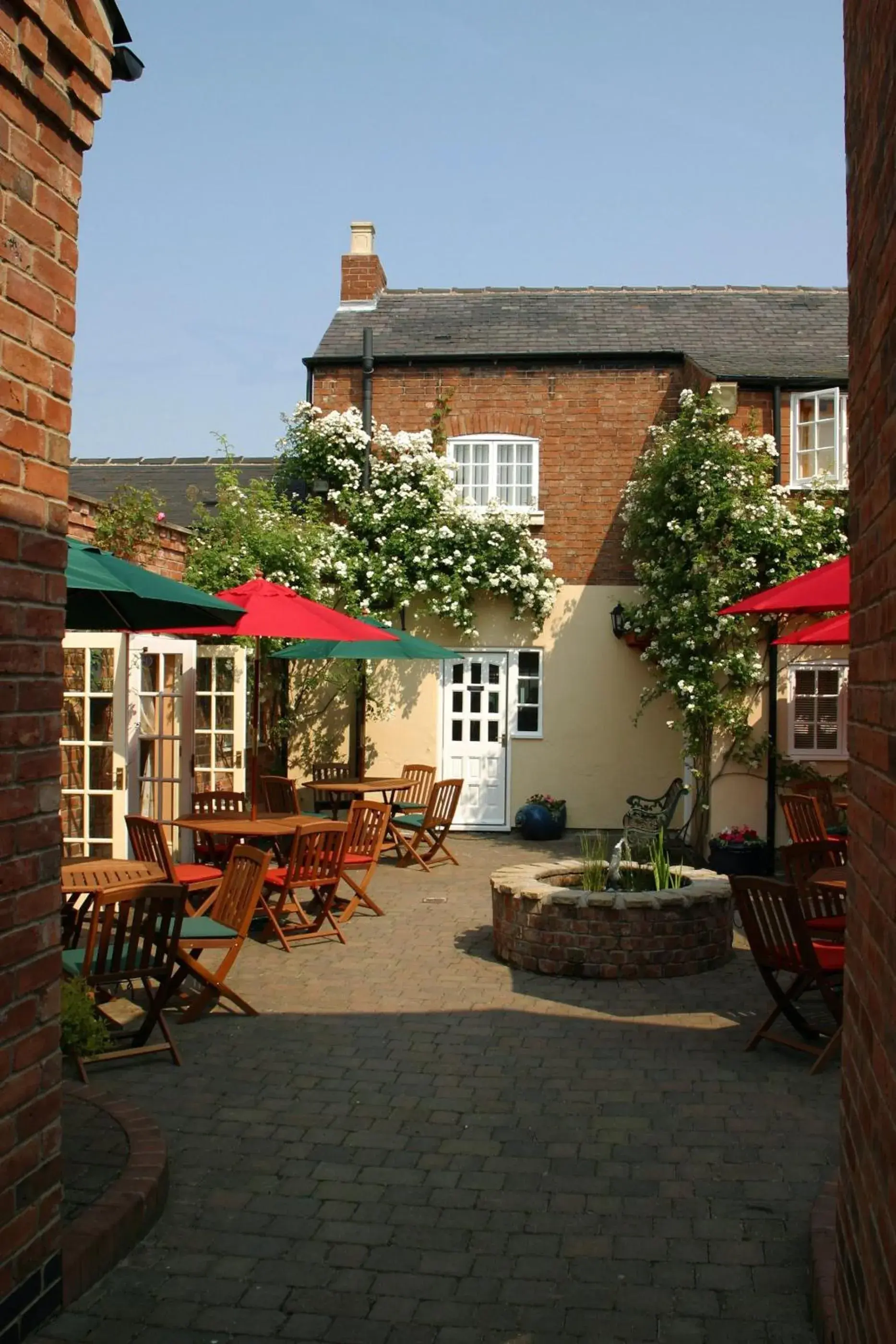 Patio, Property Building in The Cottage Hotel