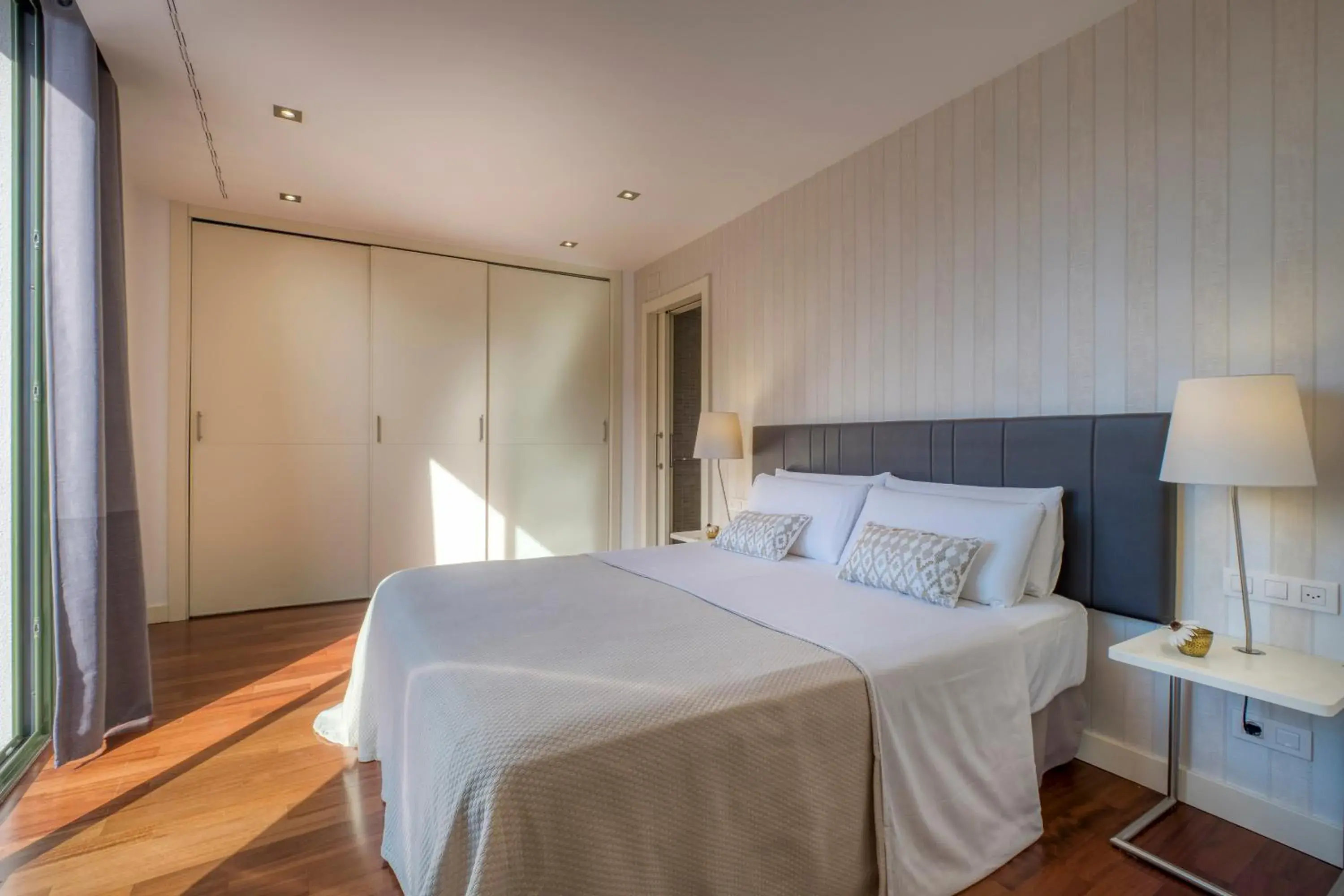 Bed in Paseo de Gracia Bas Apartments by Aspasios