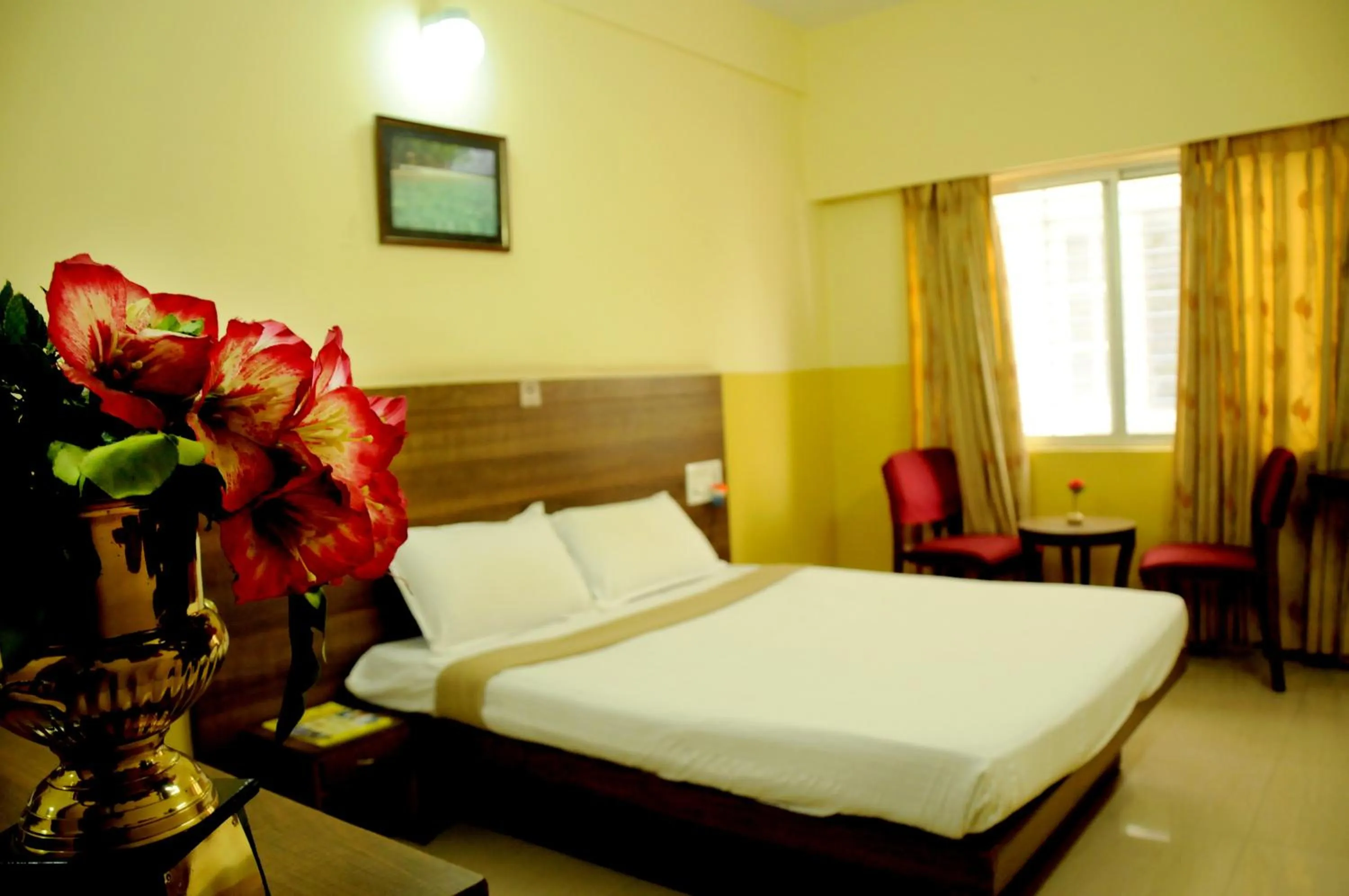 Photo of the whole room, Bed in Suvarna Residency