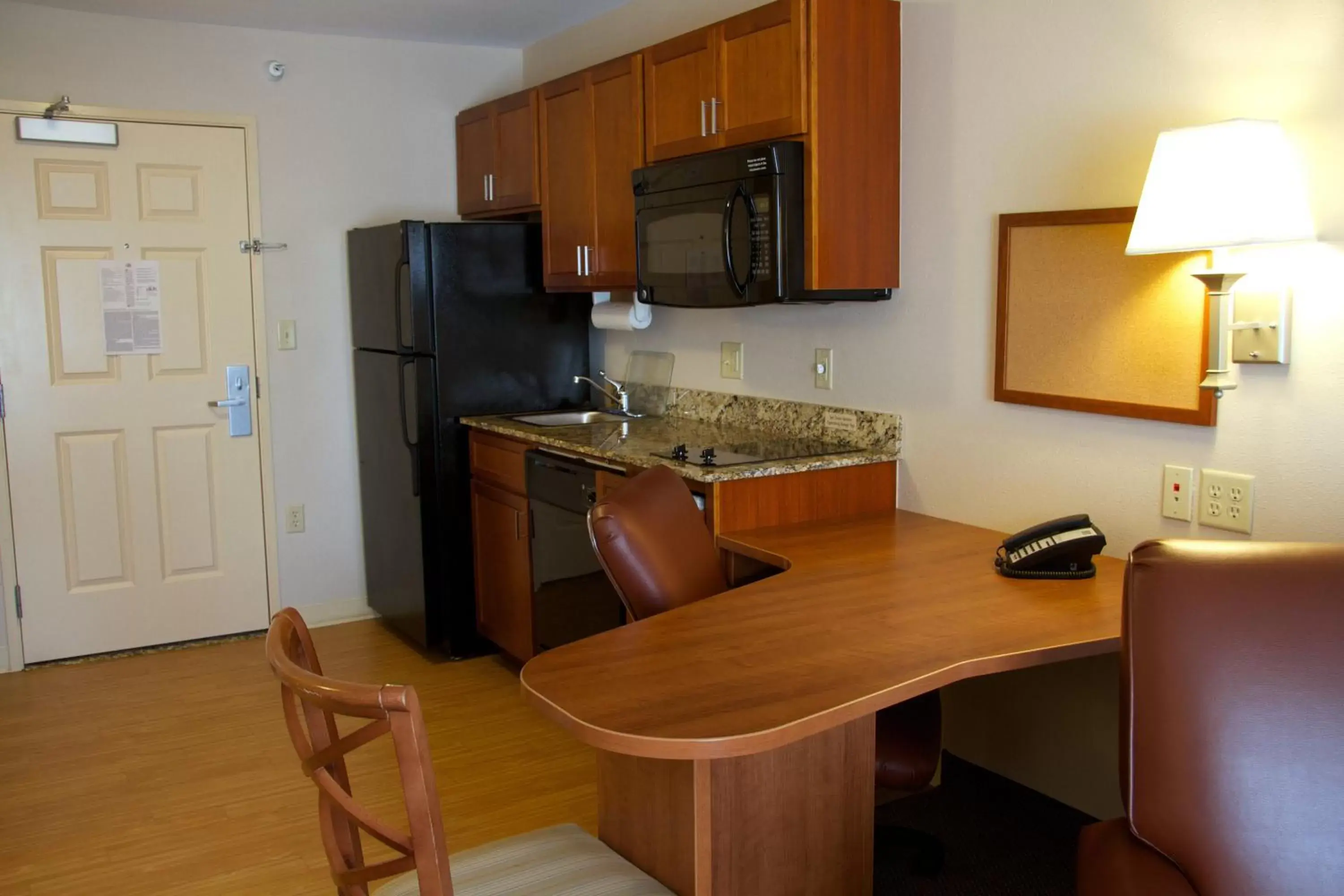 Photo of the whole room, Kitchen/Kitchenette in Candlewood Suites Champaign-Urbana University Area, an IHG Hotel