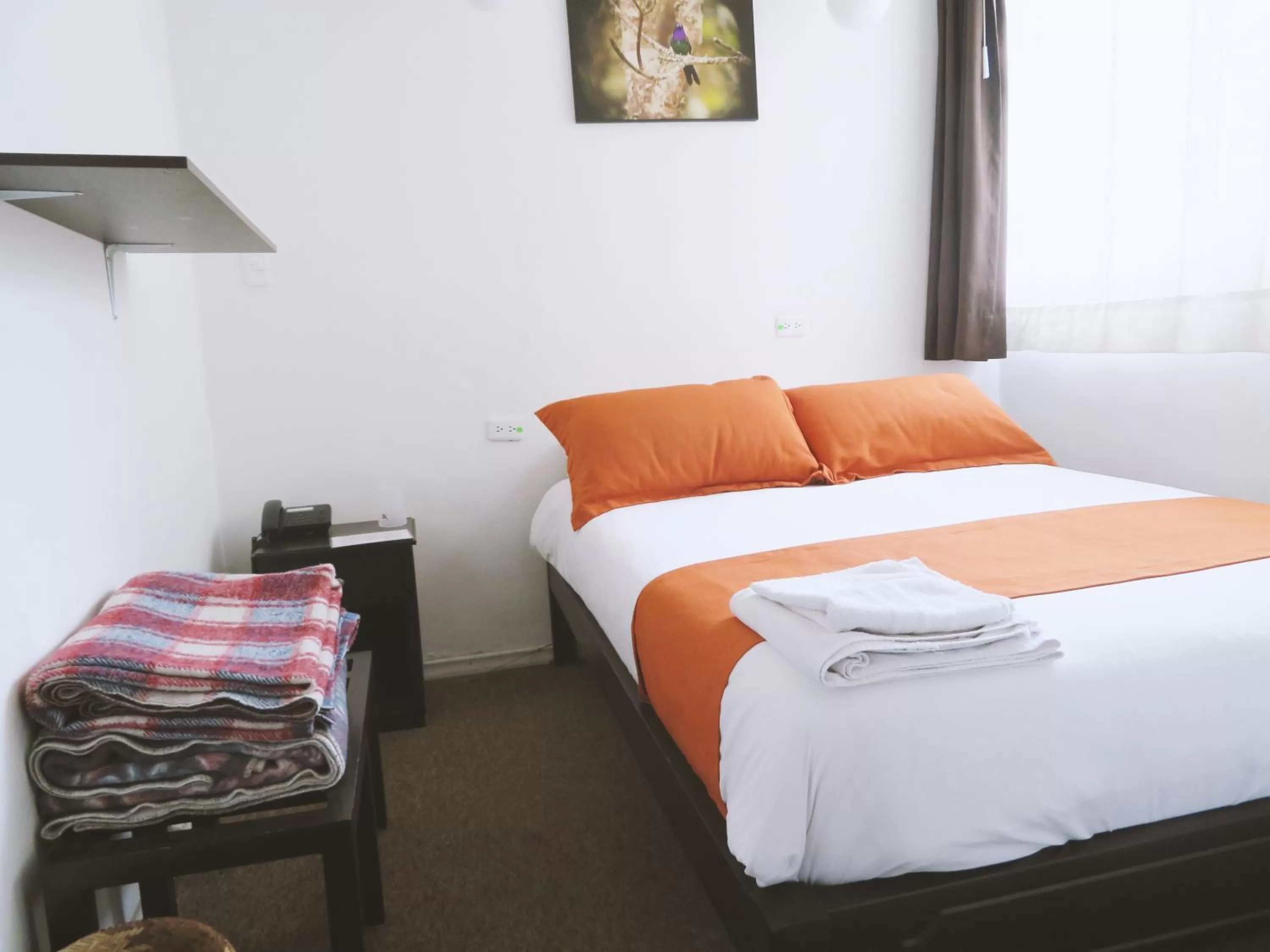 Bed in Bird Garden Guest House