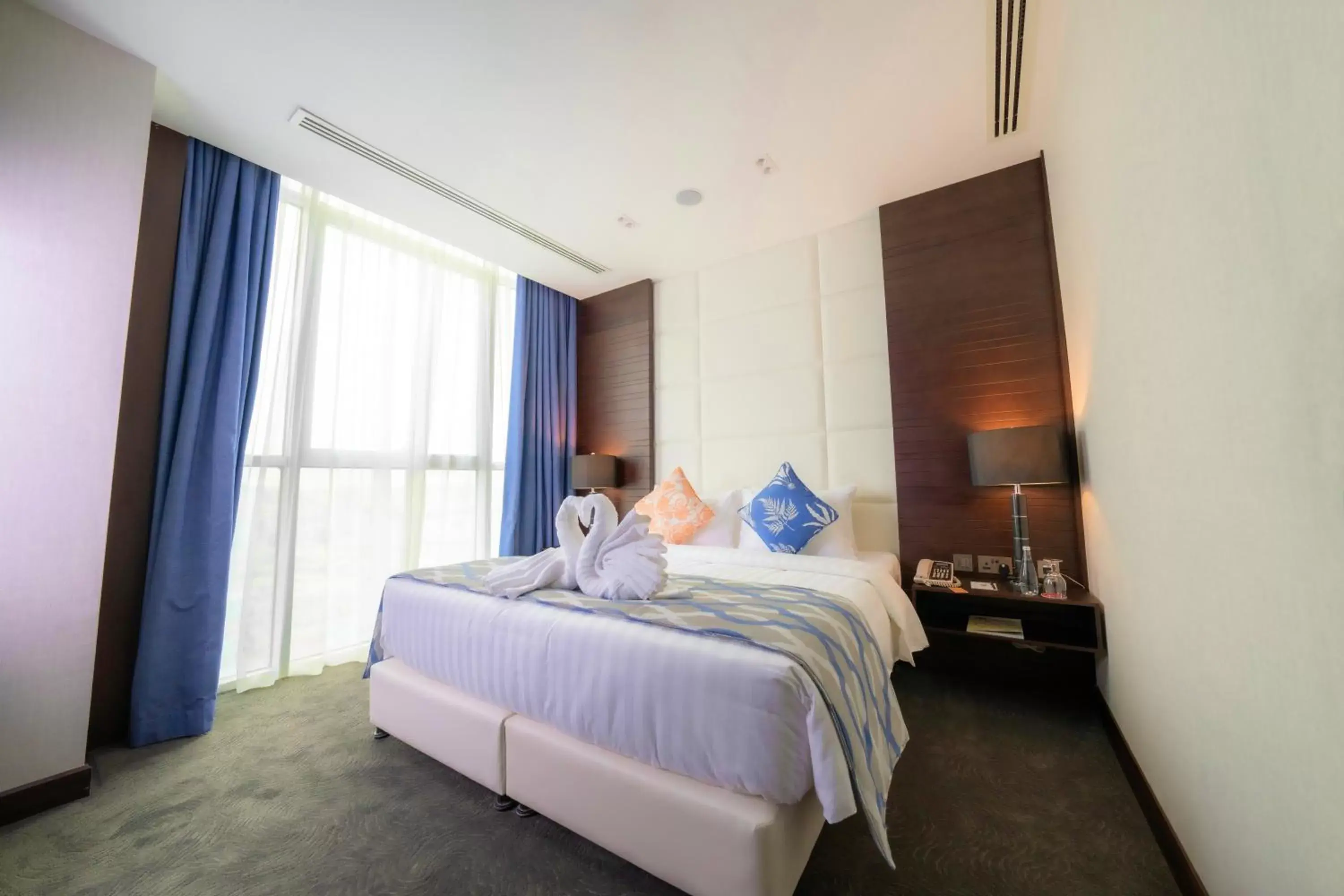 Bed in Ramada Encore Doha by Wyndham