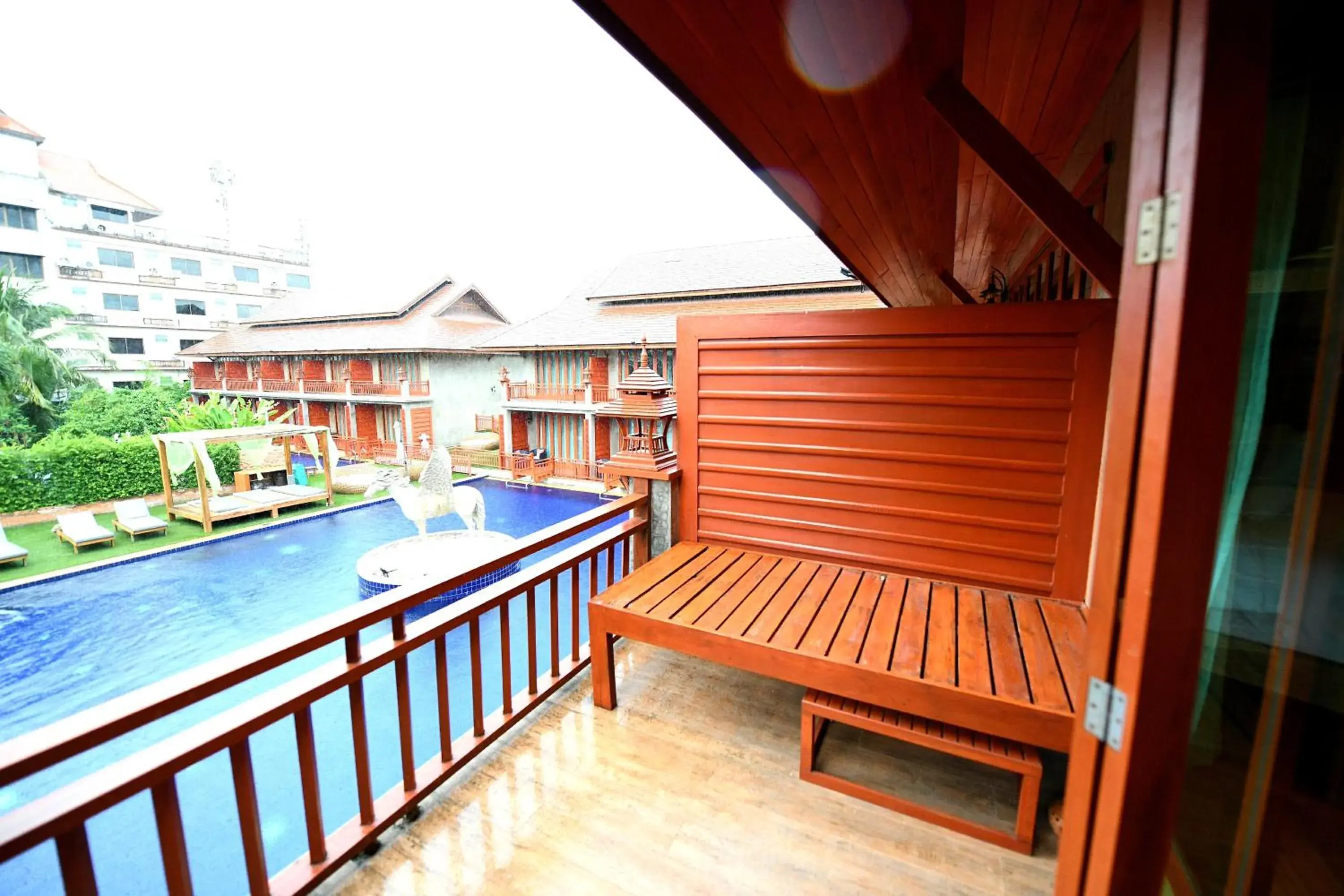 Balcony/Terrace, Pool View in The Chaya Resort and Spa