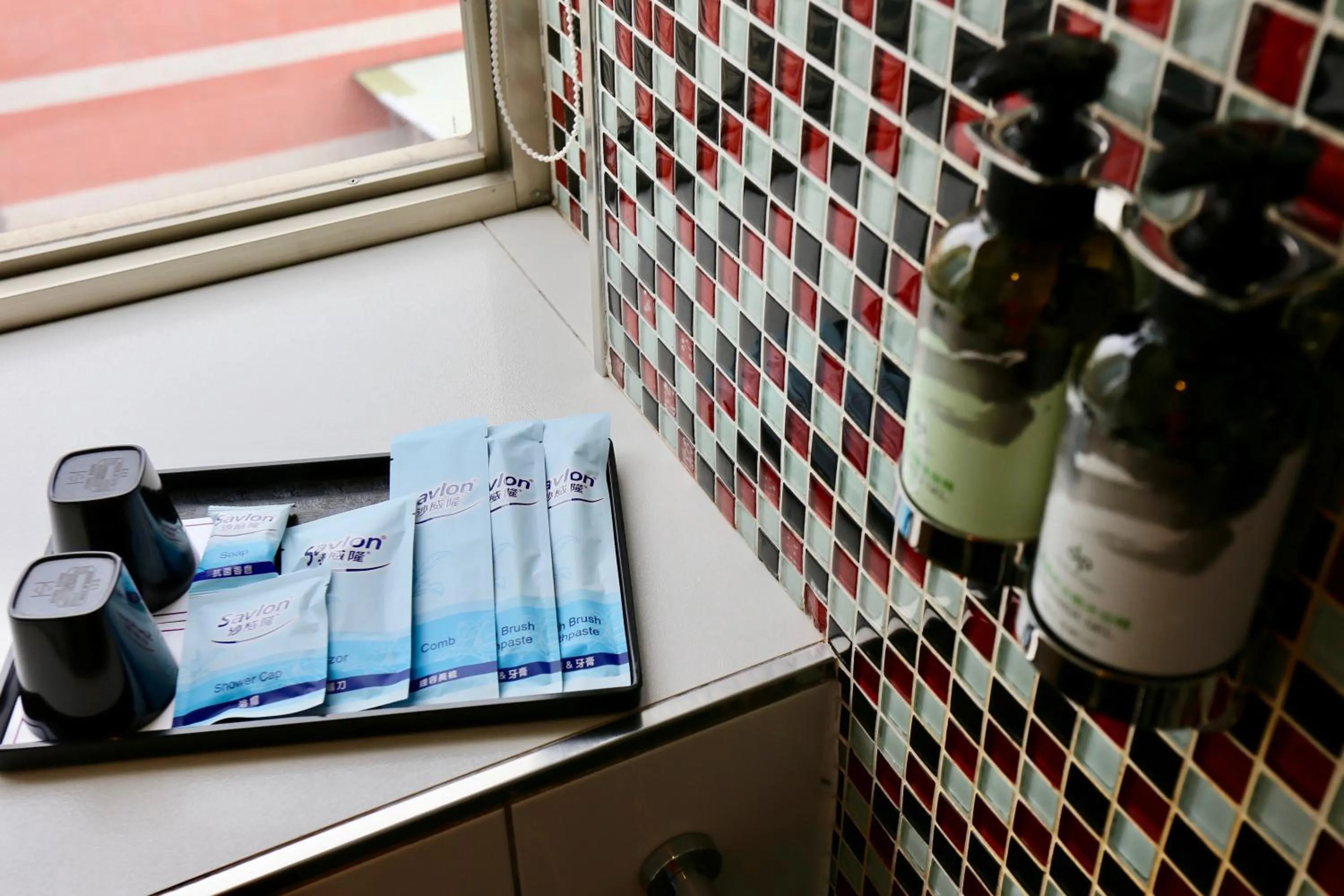 Bathroom in V-one Vogue Hotel