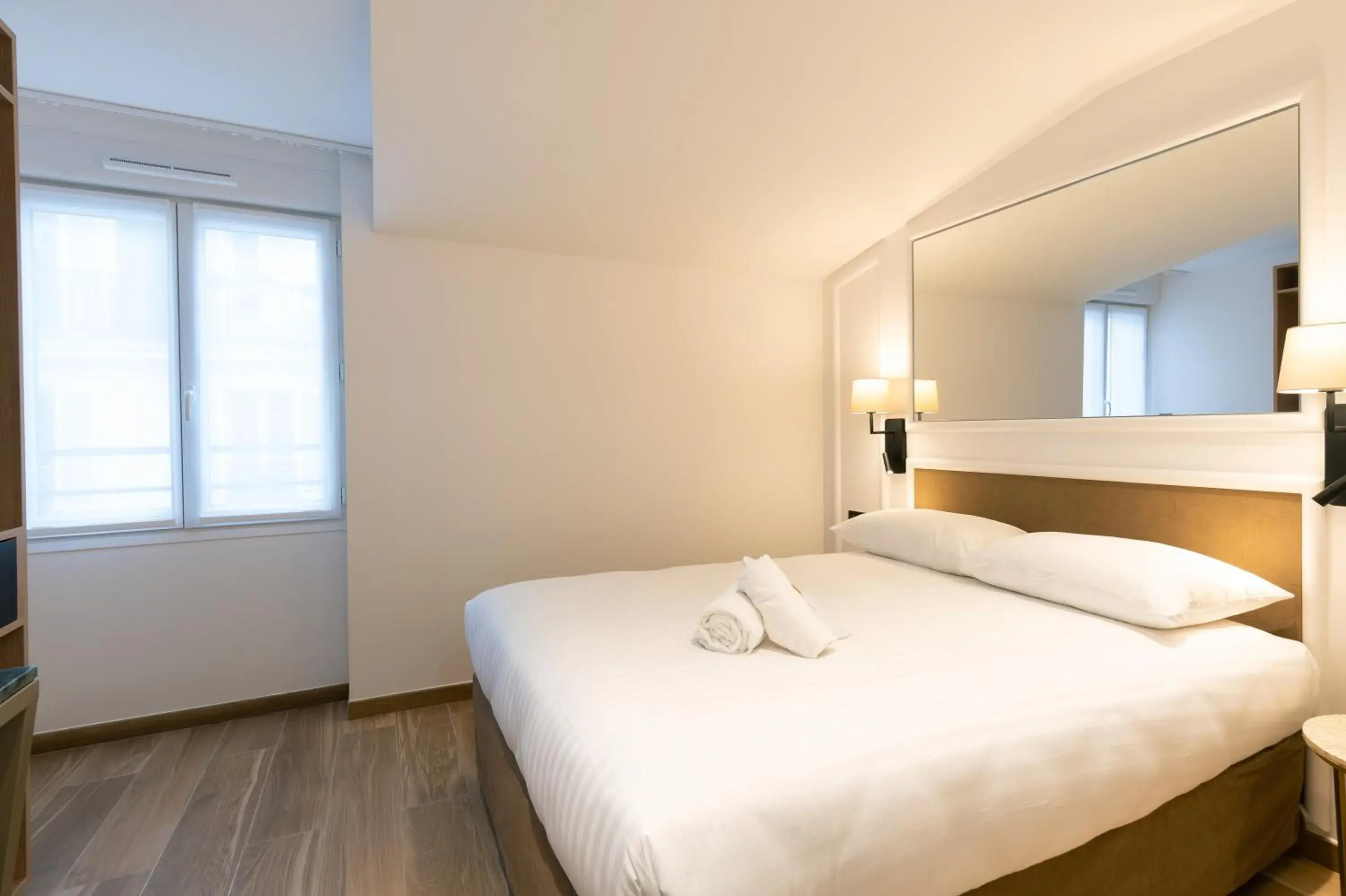 Photo of the whole room, Bed in HOTEL AU COEUR DE REPUBLIQUE