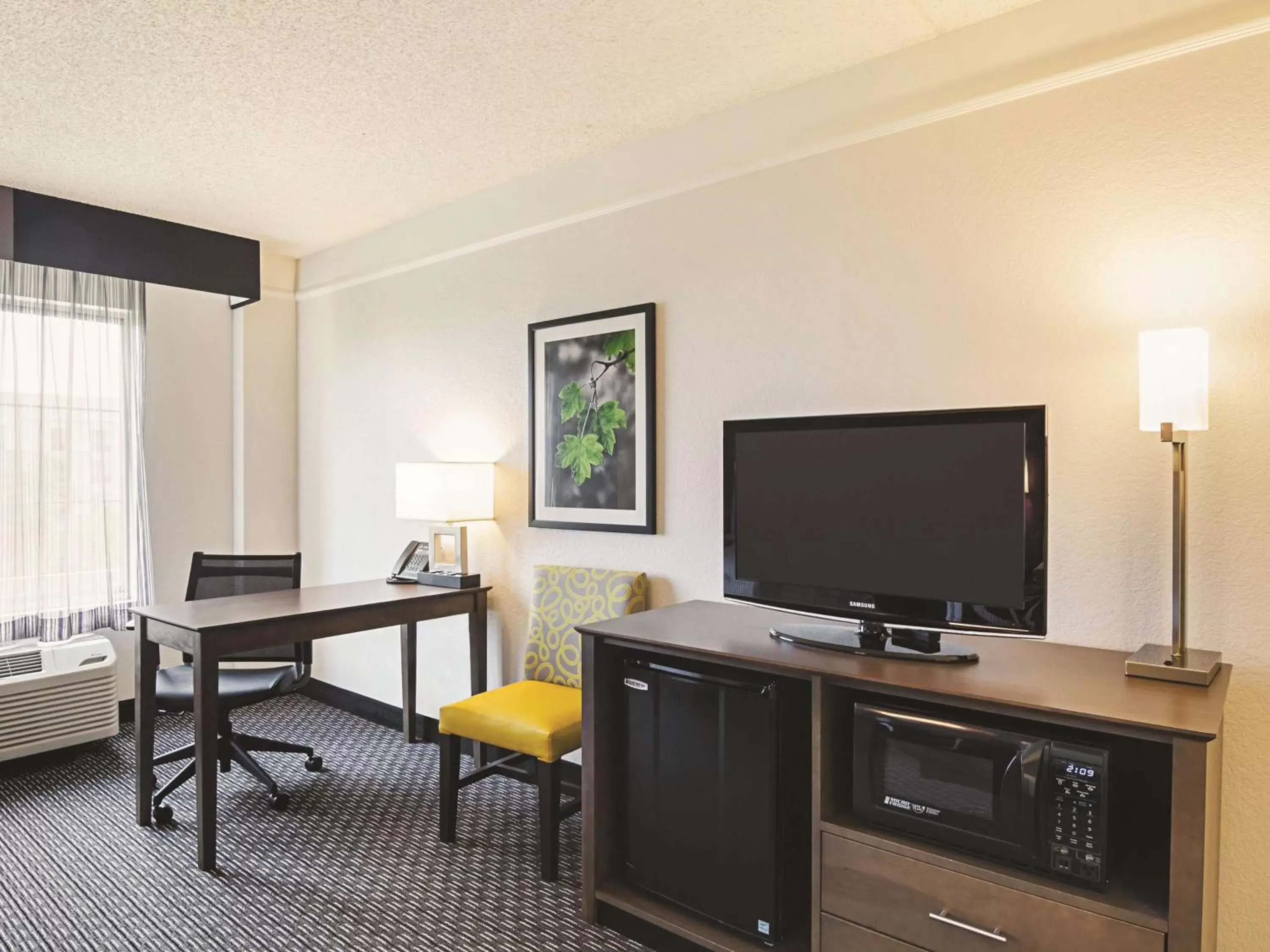 Photo of the whole room, TV/Entertainment Center in La Quinta by Wyndham Denver Airport DIA
