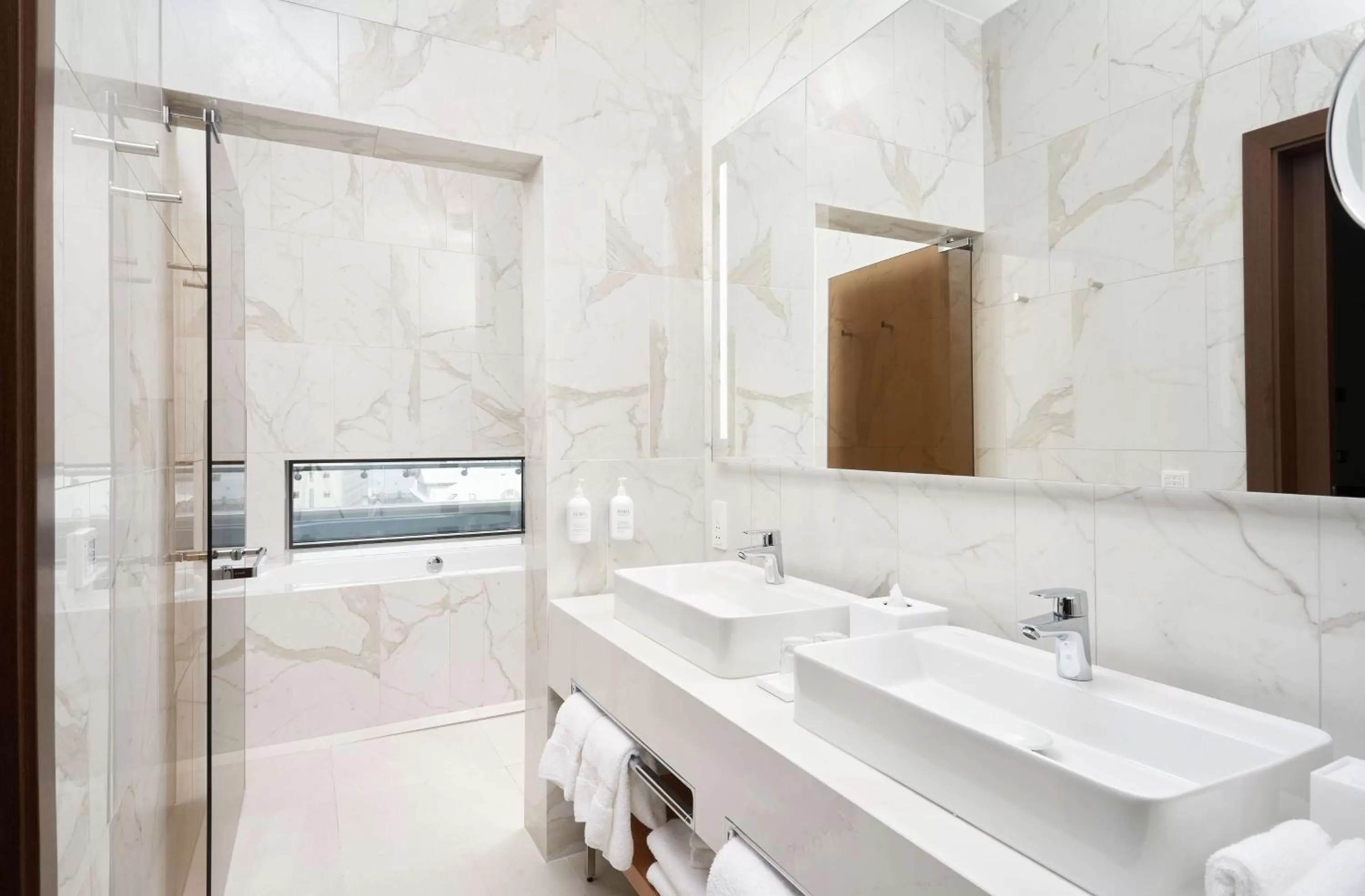 Bathroom in Iceland Parliament Hotel, Curio Collection By Hilton